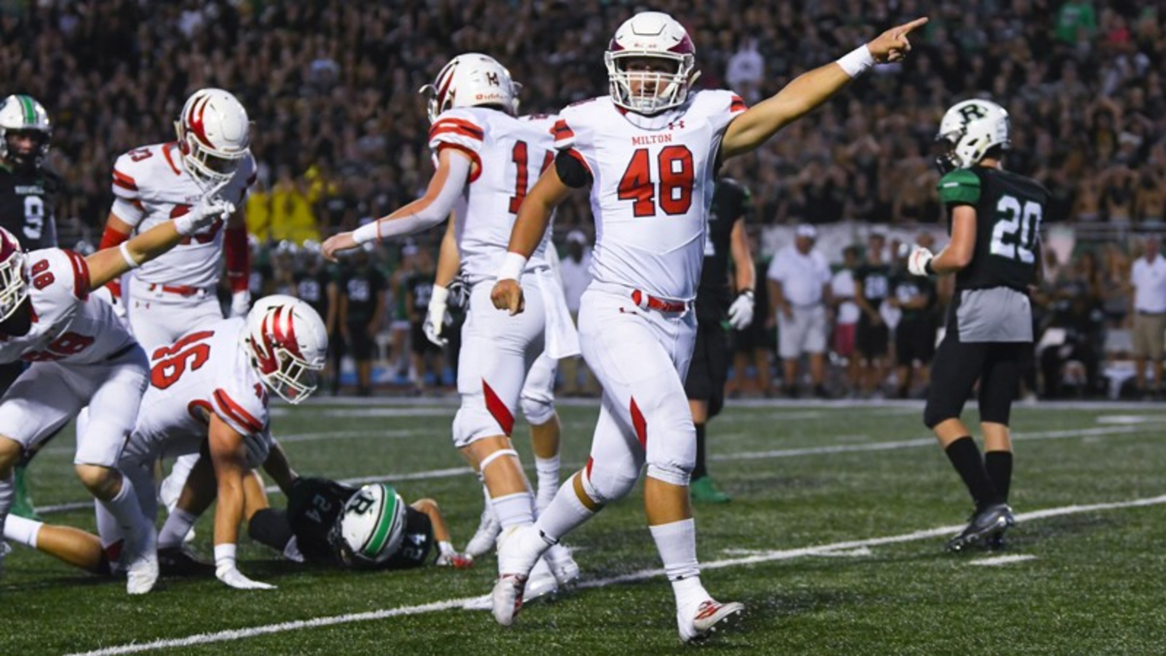 Friday Night Lights: Milton linebacker Stephen Michaels celebrates after a fumble recovery against Roswell during the first quarter of Friday's Milton-Roswell game in Roswell. (John Amis/Special)