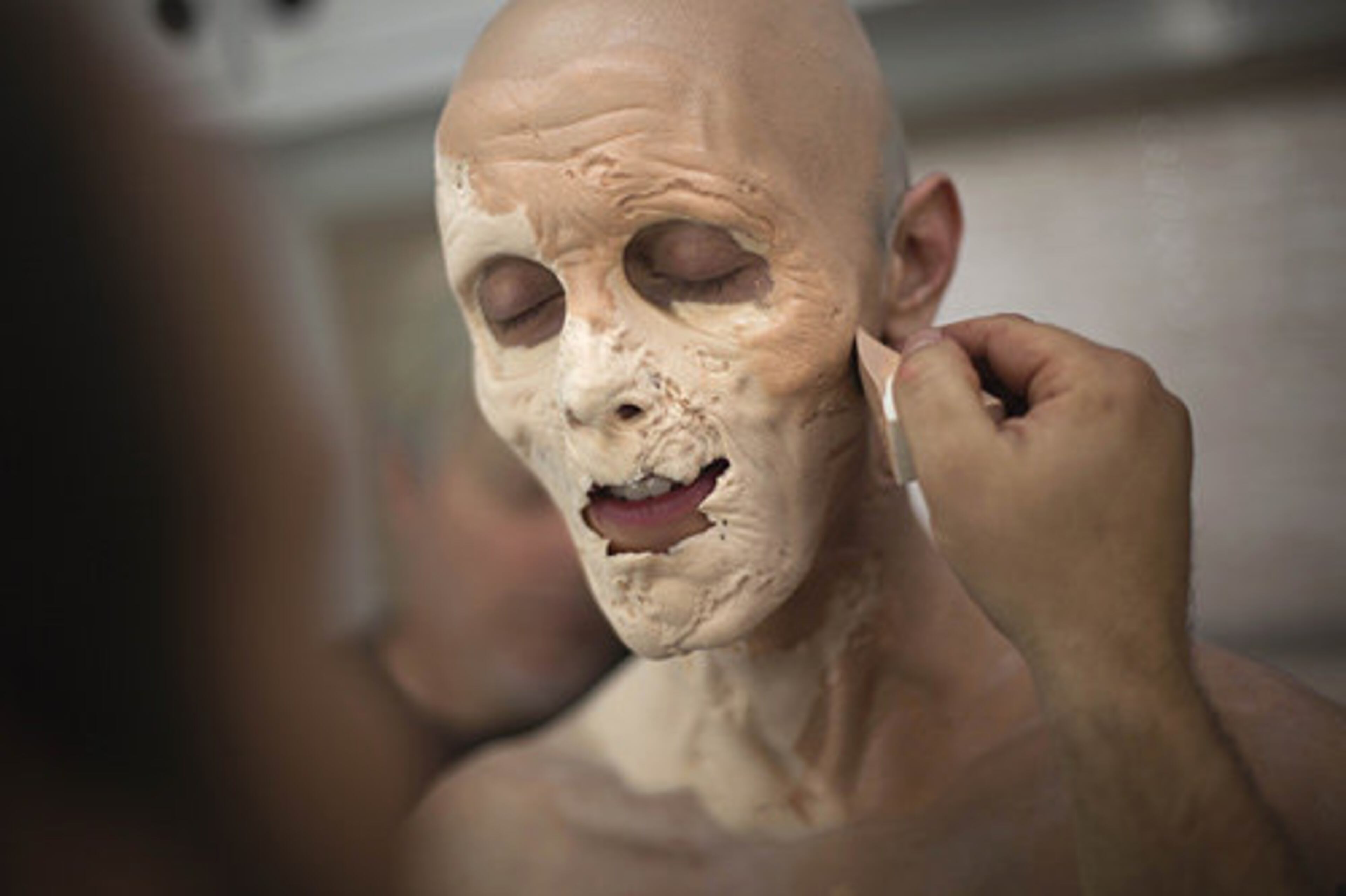Special makeup is applied to Kevin's face in order to give him a more "gaunt" appearance. AP