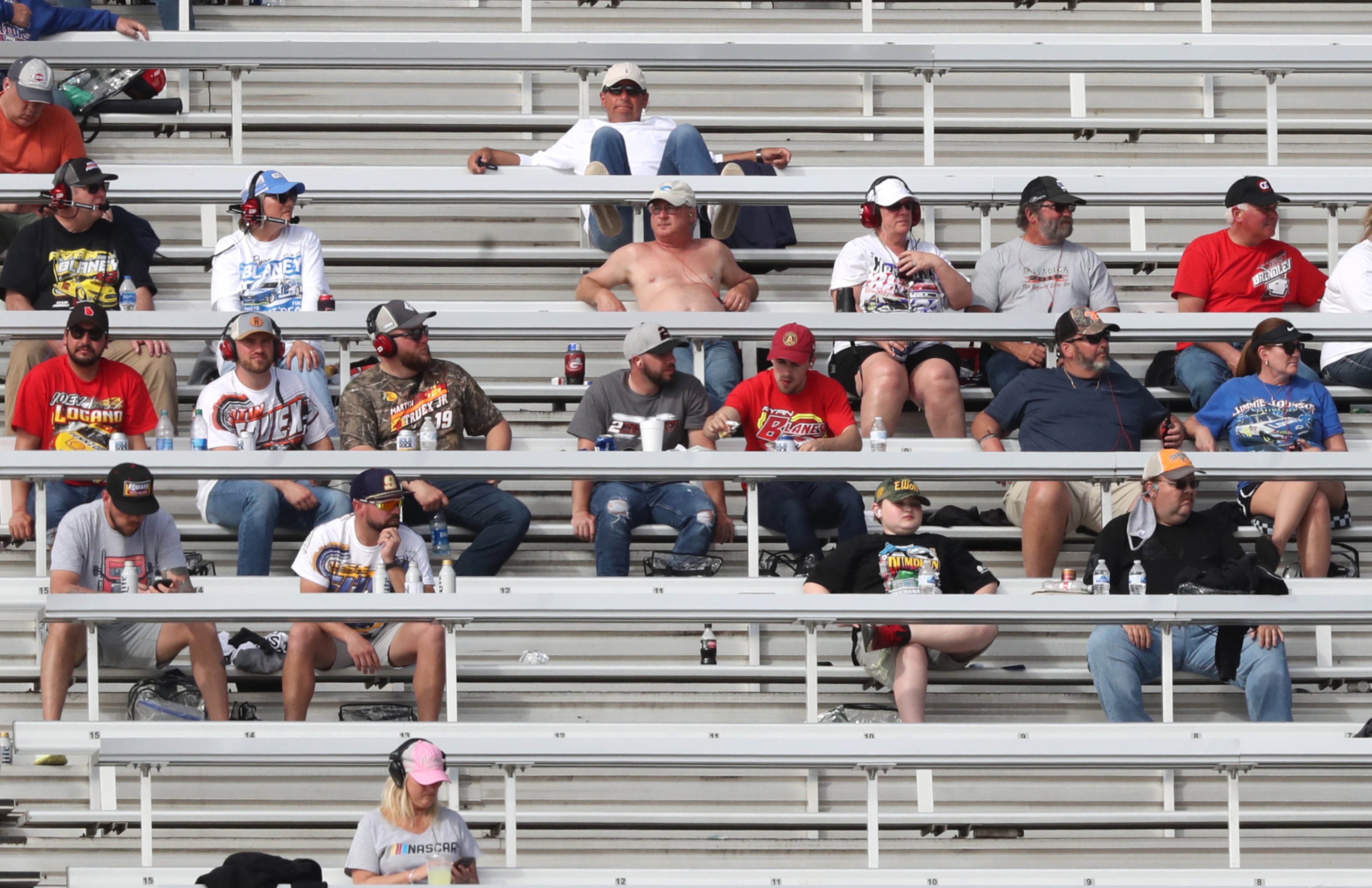 NASCAR fans soak up the sun while taking in the Folds of Honor QuikTrip 500 from the grandstands of Atlanta Motor Speedway Sunday, March 21, 2021, in Hampton. (Curtis Compton / Curtis.Compton@ajc.com)