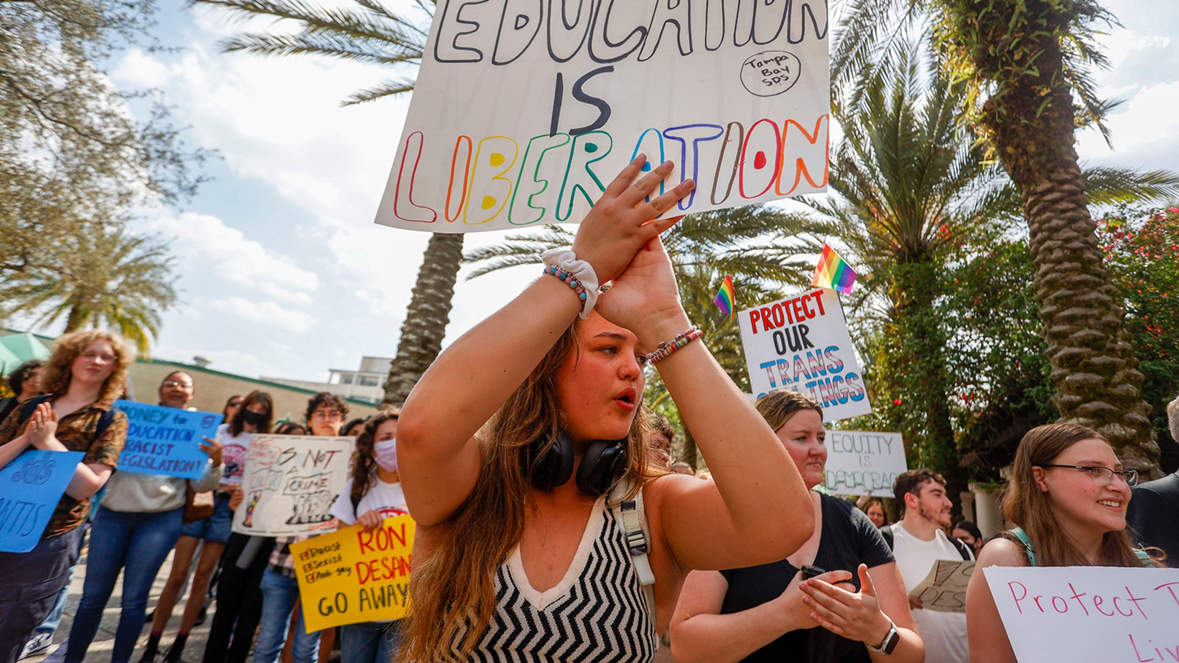 Sophie Craig, 19, cheers during a gathering after University of South Florida students and faculty members join a statewide student walkout to protest Gov. Ron DeSantis' education policies on Feb. 23, 2023. (Ivy Ceballo/Tampa Bay Times/TNS)