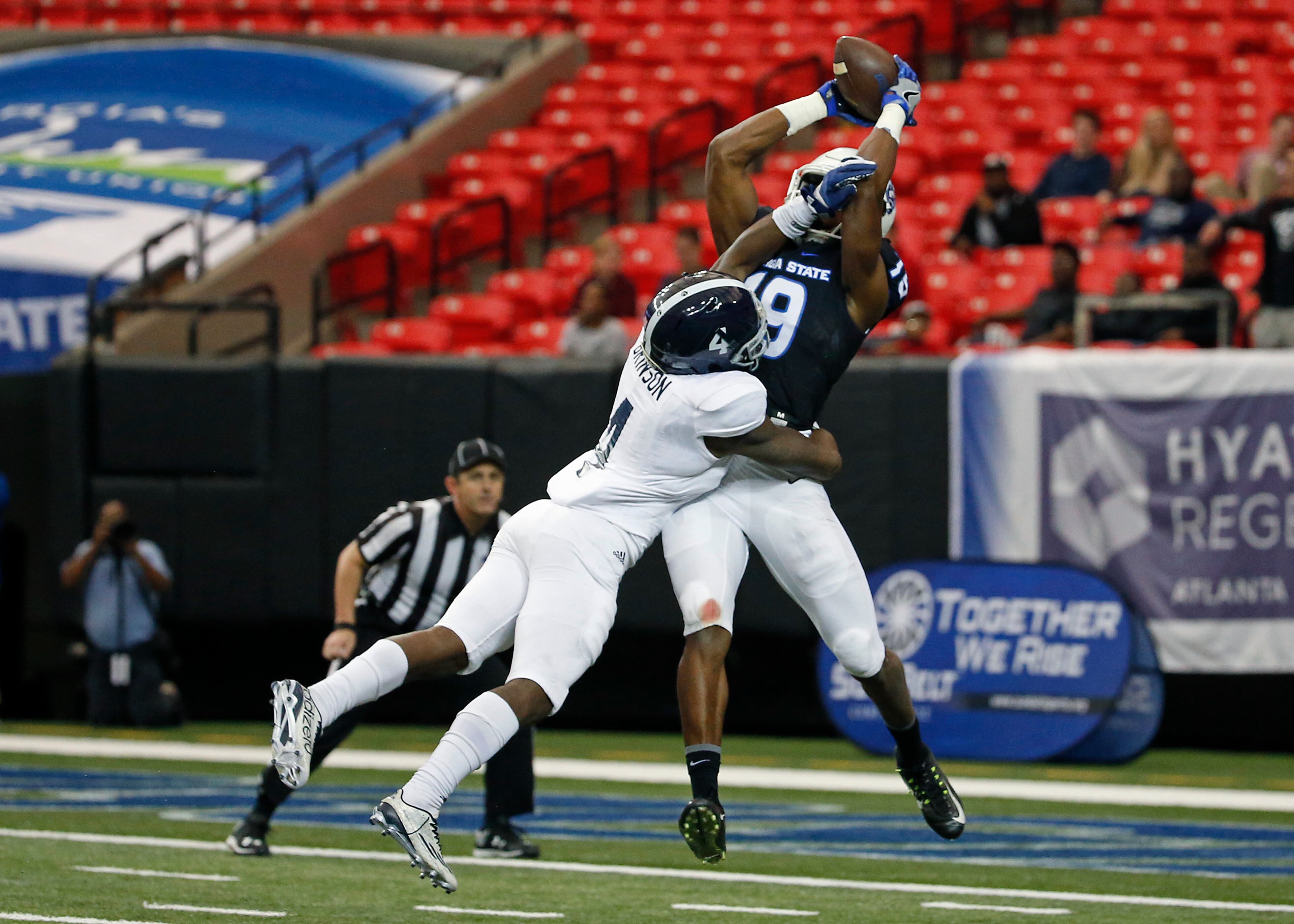 November 19, 2016 - Atlanta, Ga: Georgia State Panthers wide receiver Robert Davis (19) catches a touchdown against Georgia Southern Eagles cornerback Monquavion Brinson (4) during the first half at the Georgia Dome Saturday November 19, 2016, in Atlanta, Ga. PHOTO / JASON GETZ
