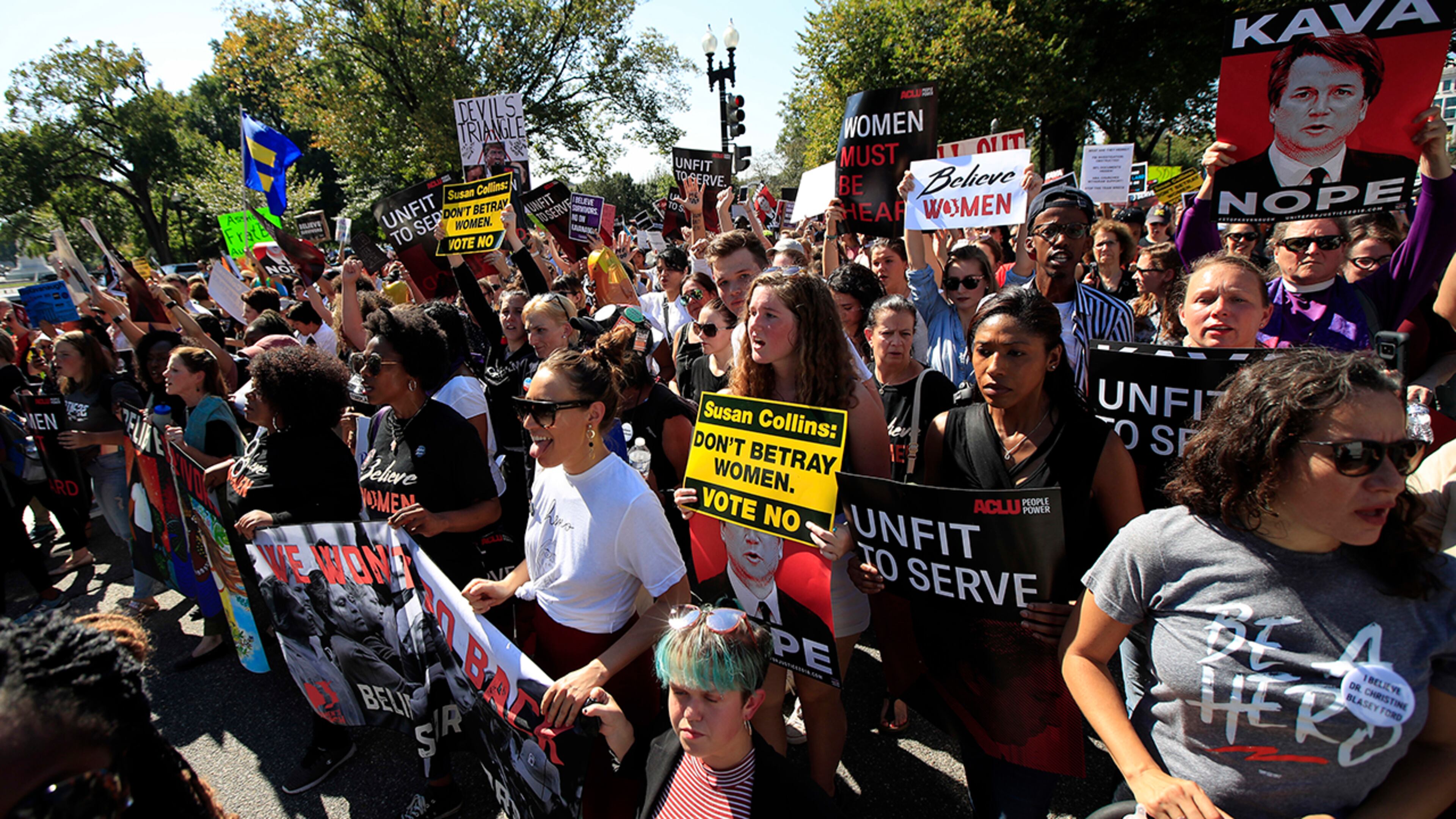Protesters march toward the Supreme Court as they demonstrate against Supreme Court nominee Brett Kavanaugh in Washington, Thursday, Oct. 4, 2018. (AP Photo/Manuel Balce Ceneta)