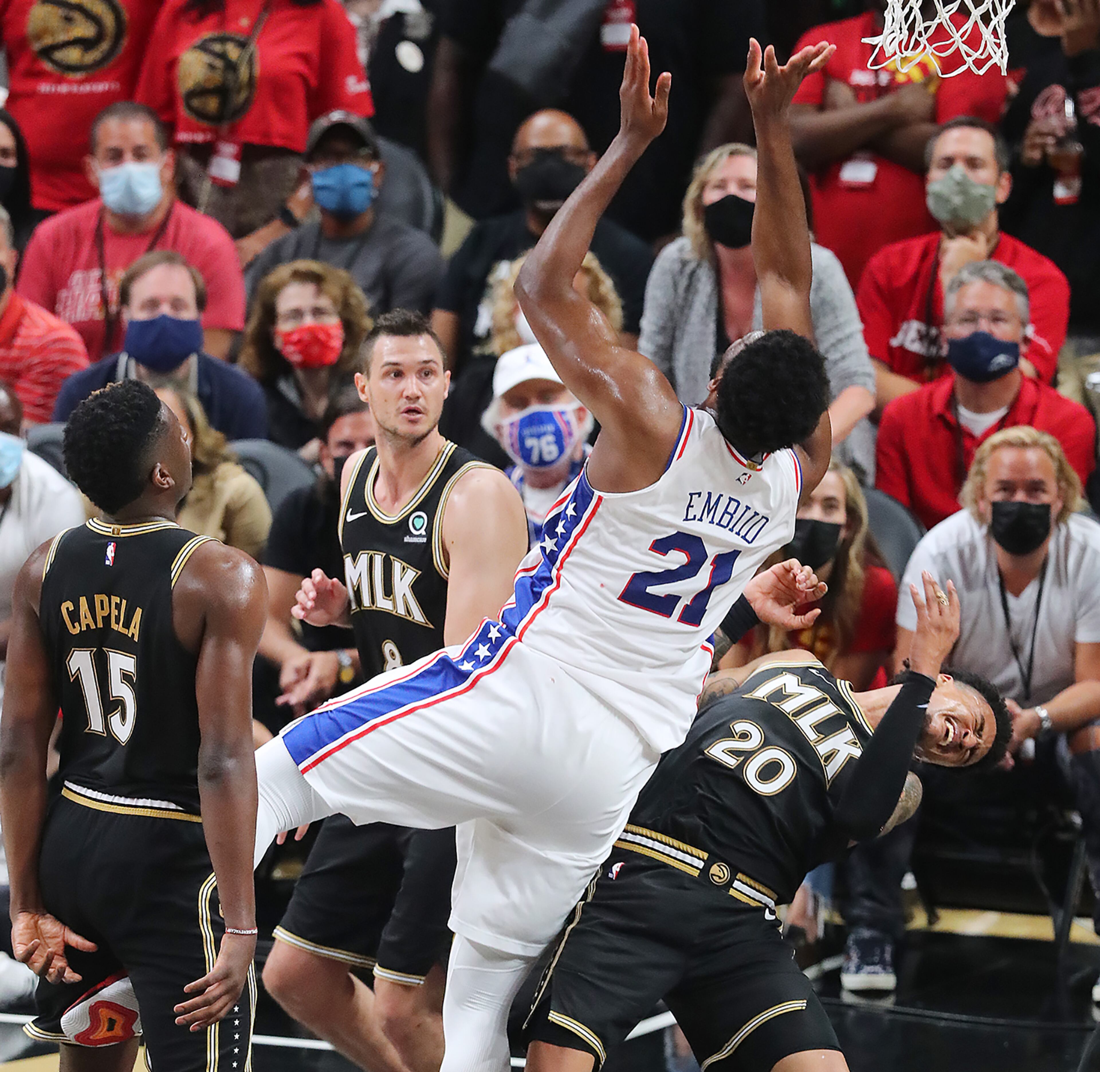 Philadelphia 76ers' Joel Embiid is called for an offensive foul against Atlanta Hawks forward John Collins, who was called for a technical foul, during the 4th quarter. “Curtis Compton / Curtis.Compton@ajc.com”