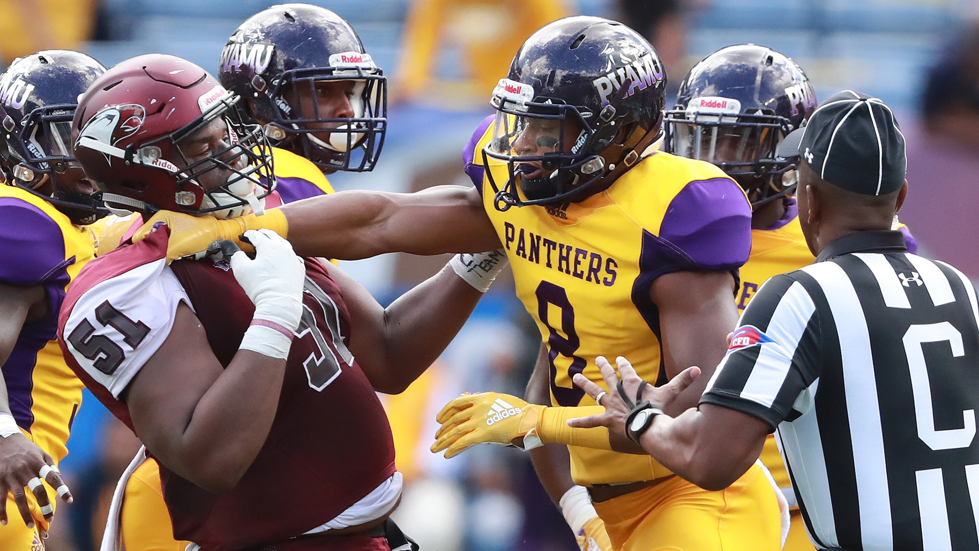 North Carolina Central offensive lineman Nick Leverett and Prairie View A&M wide receiver Quinton Bell get into a shoving match during the first half of the MEAC-SWAC Challenge Sunday, Sept. 2, 2018, in Atlanta.