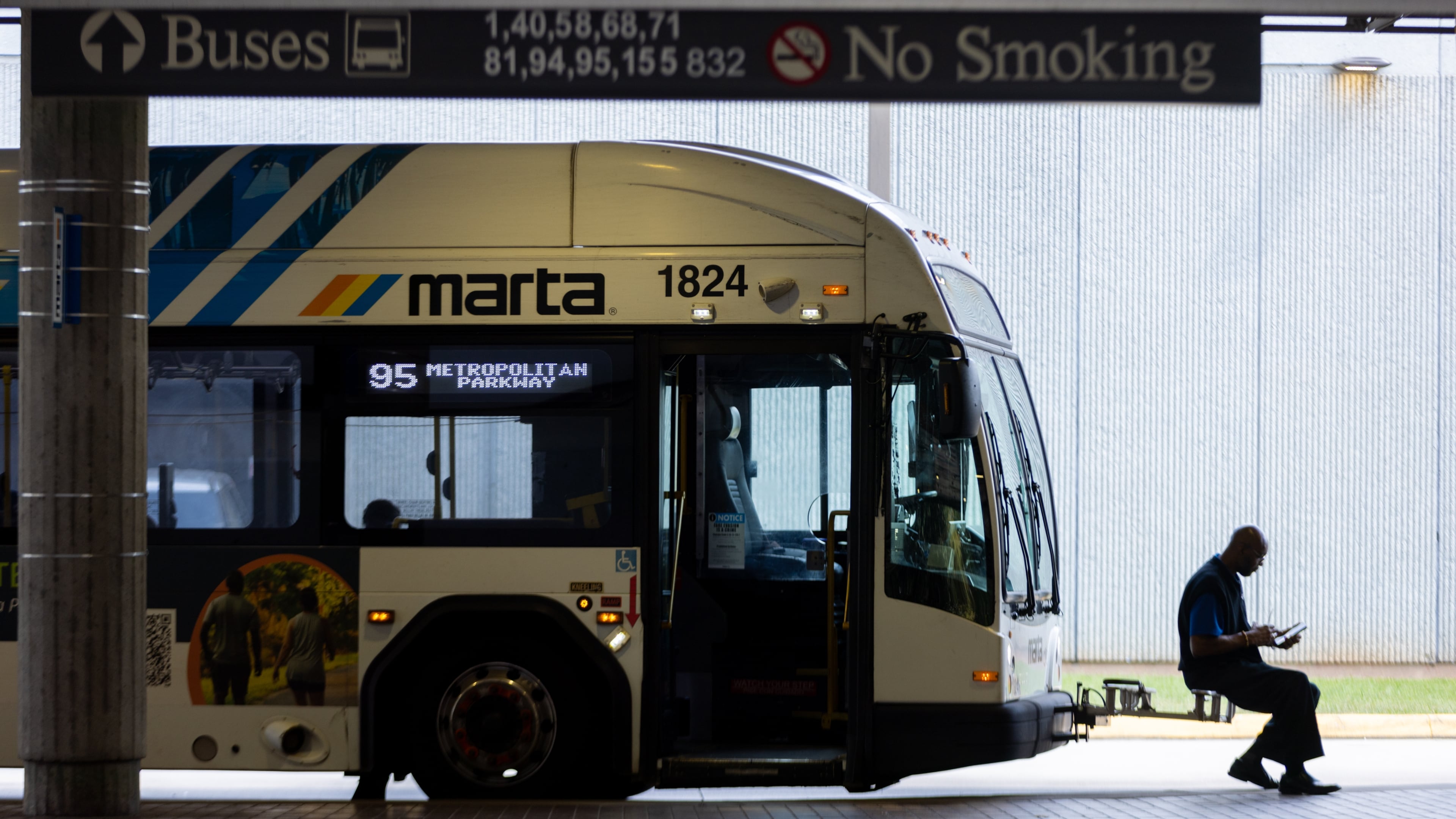 A bus driver waits at the West End MARTA station in Atlanta. (Arvin Temkar/AJC 2025)