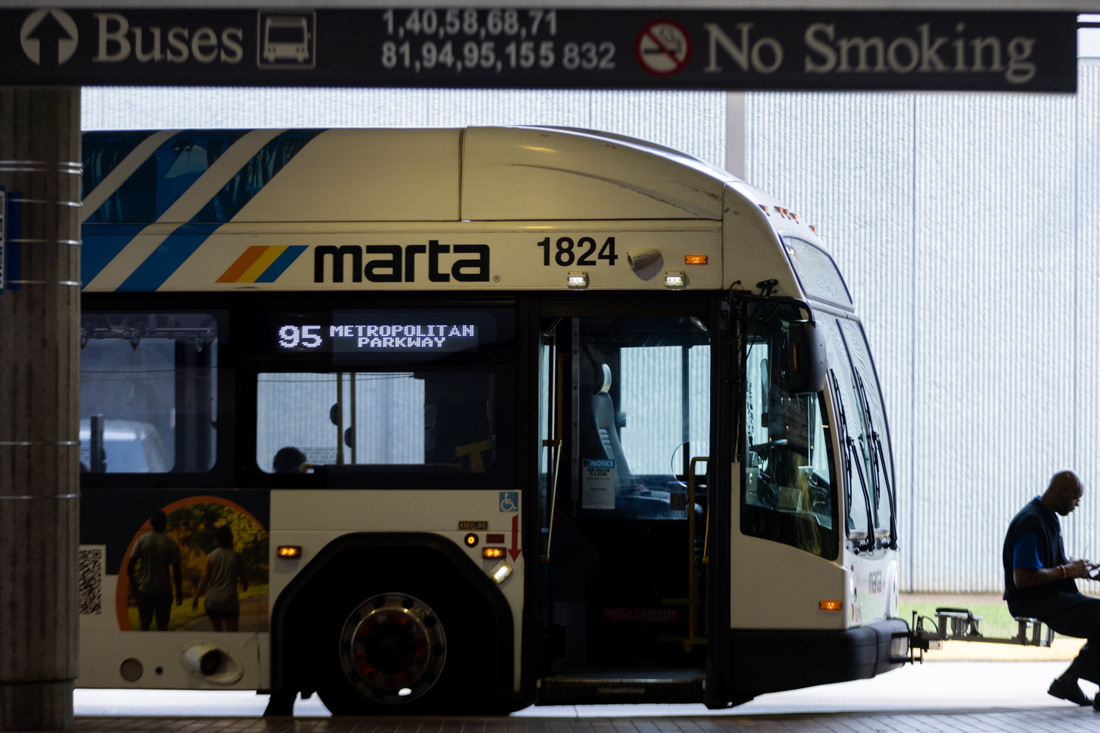 A bus driver waits at the West End MARTA station in Atlanta. (Arvin Temkar/AJC 2025)