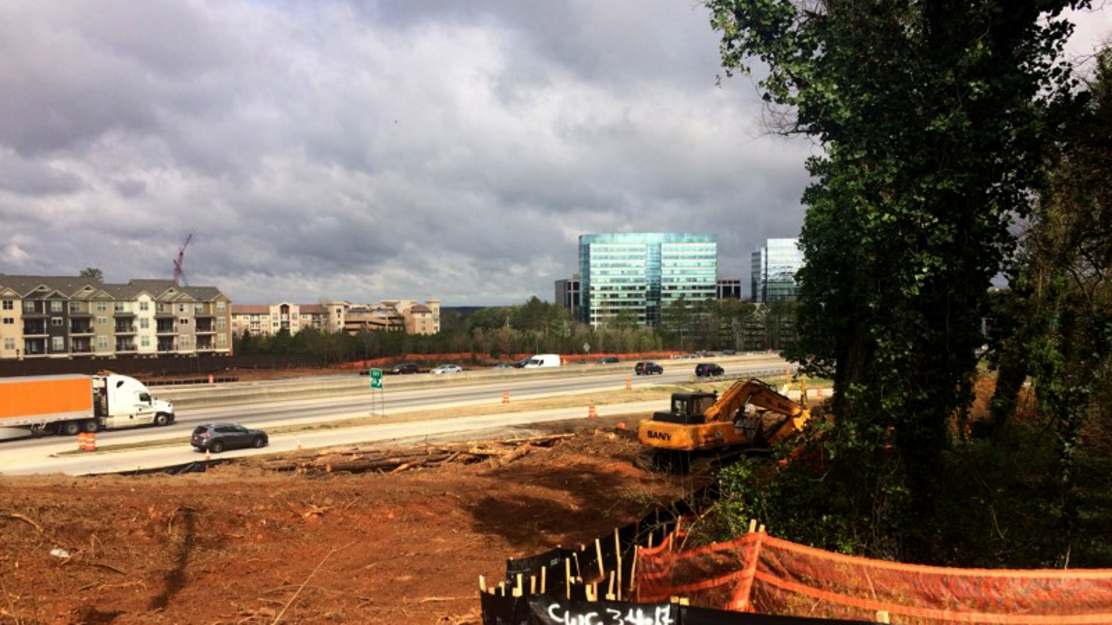 Trees are being removed from the side of Ga. 400 as part of a four-year, $800 million reconstruction of the interchange at the top of the Perimeter in the Dunwoody-Sandy Springs area. BECCA GODWIN/AJC FILE