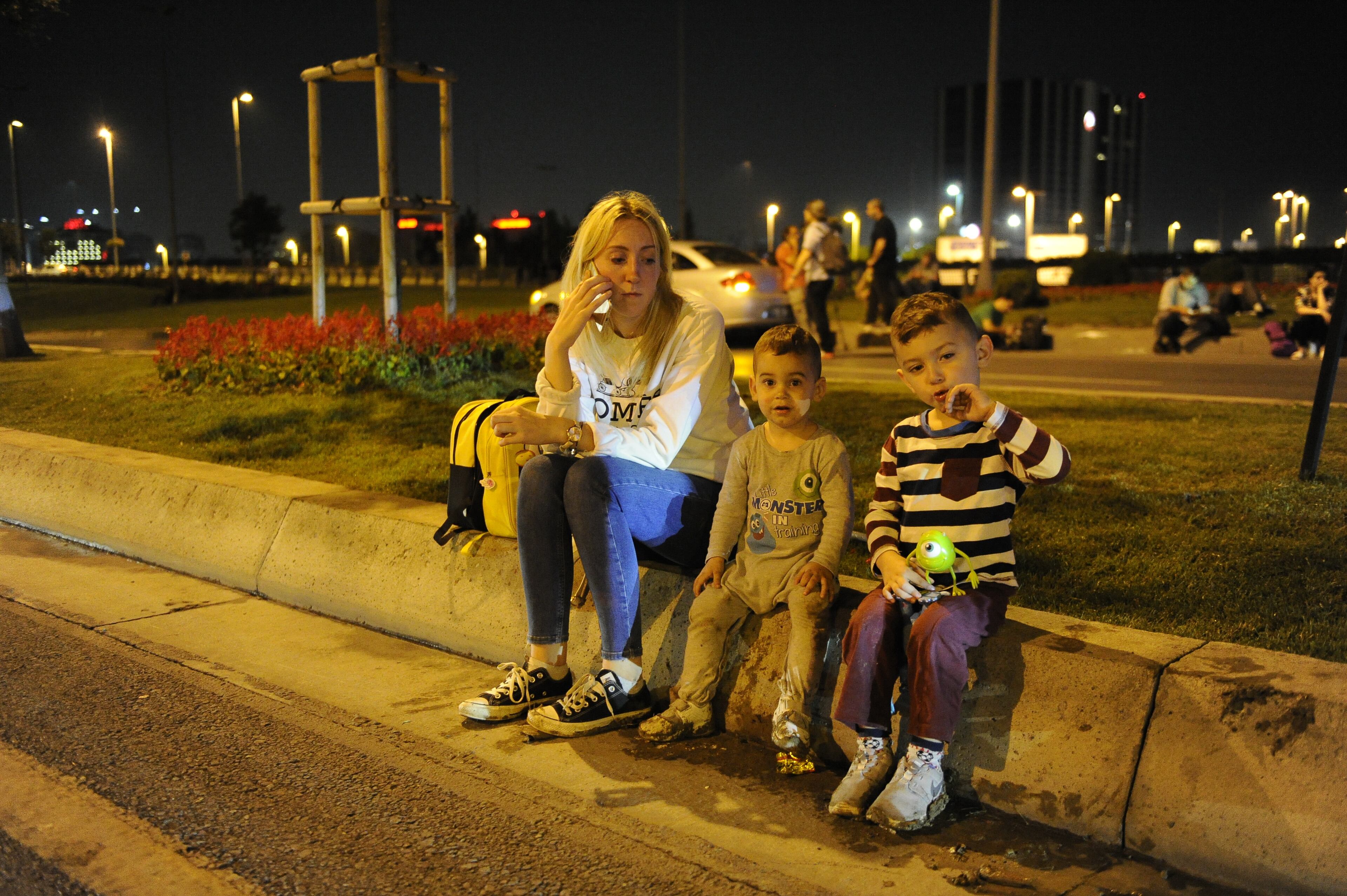 Passengers wait outside the Turkey's largest airport, Istanbul Ataturk after the suicide bomb attacks, June 28, 2016, Turkey. Three suicide bombers opened fire before blowing themselves up at the entrance to the main international airport in Istanbul, killing at least 28 people and wounding at least 60 people according to Istanbul governor Vasip Sahin. (Photo by Gokhan Tan/Getty Images)