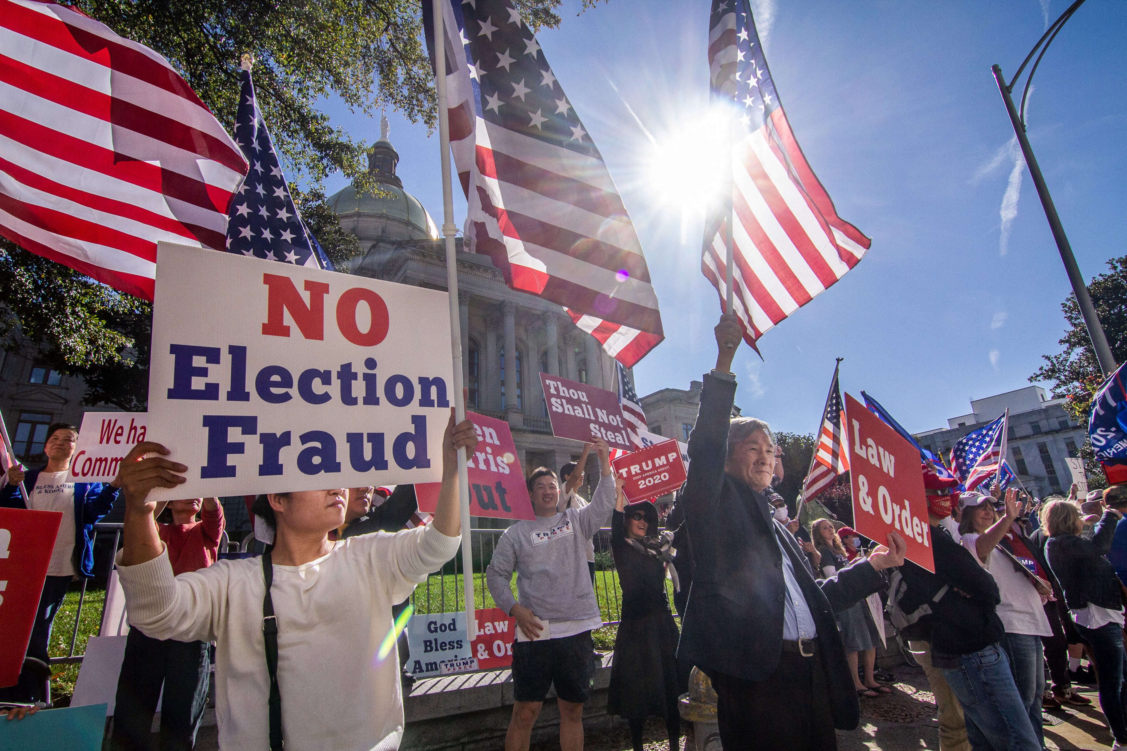Protesters in support of President Trump demonstrate against the election results along Martin Luther King Jr. Drive in front of the state Capitol in Atlanta on Saturday, November 14, 2020. Some of them charged election fraud over Democrat Joe Biden being projected as the winner. (Photo: Steve Schaefer for The Atlanta Journal-Constitution)