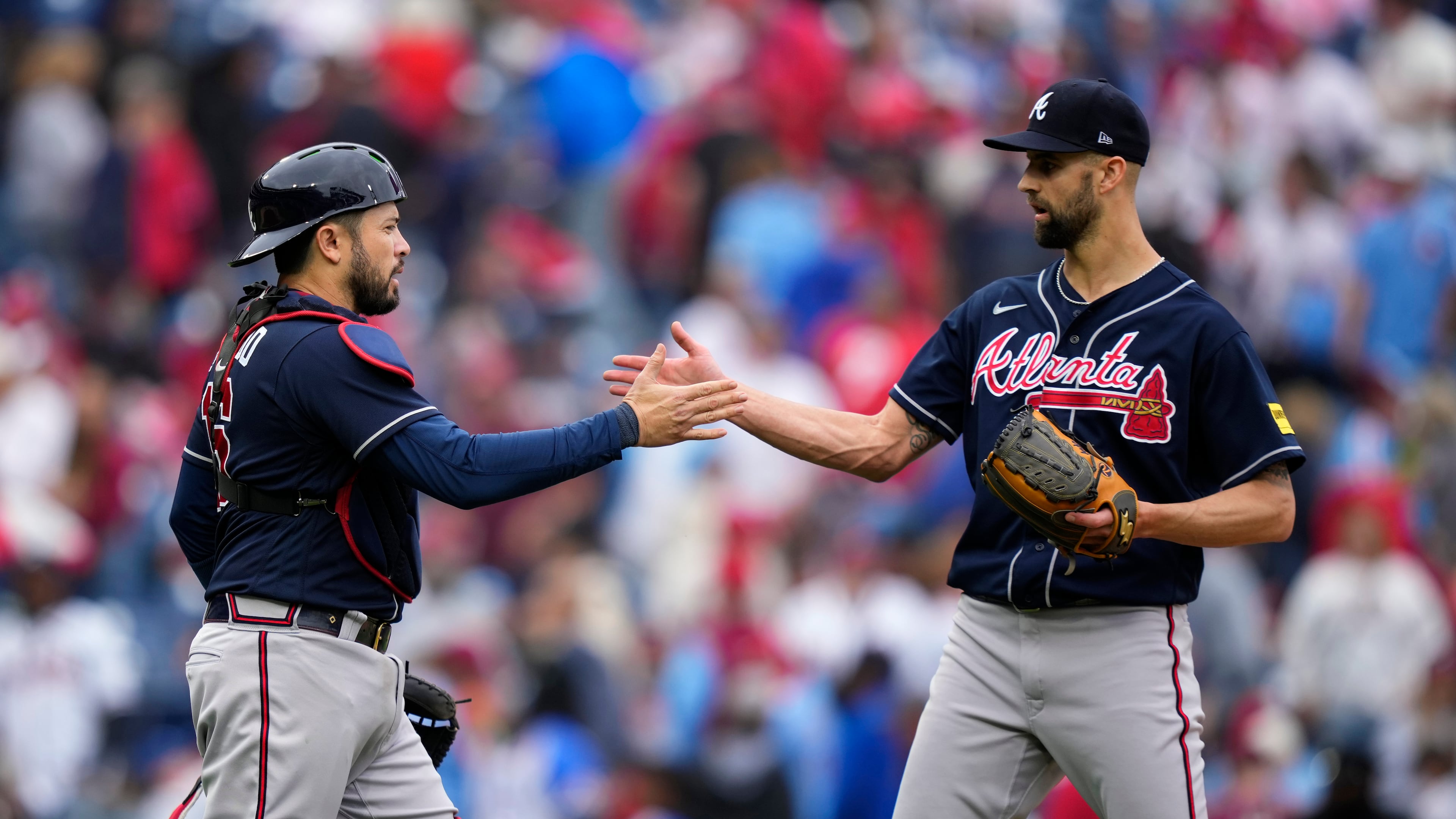 Atlanta Braves' Nick Anderson, right, and Travis d'Arnaud celebrate after the Braves won a baseball game against the Philadelphia Phillies, Thursday, June 22, 2023, in Philadelphia. (AP Photo/Matt Slocum)