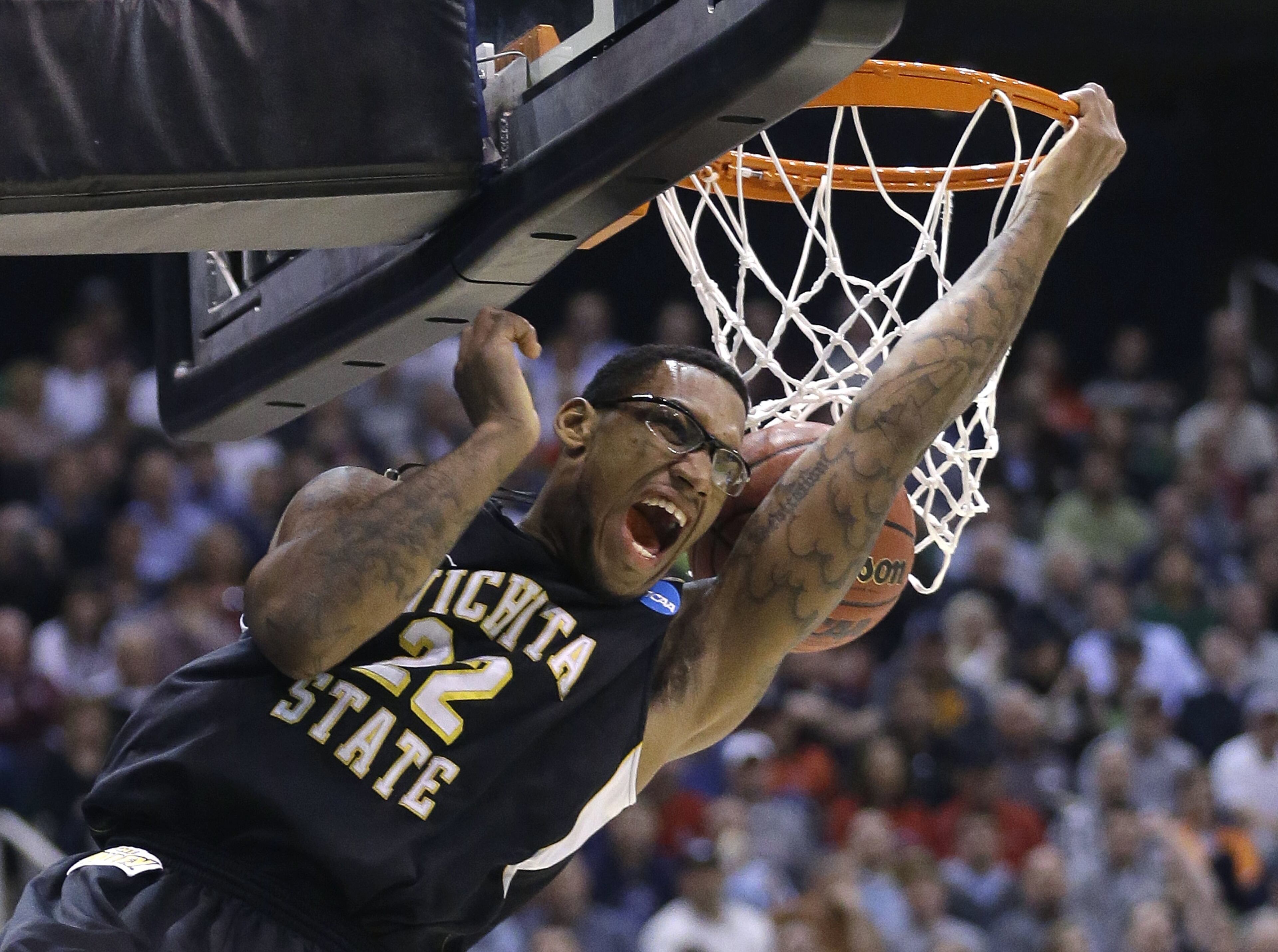 Wichita State's Carl Hall (22) dunks the ball in the first half during a third-round game against Gonzaga in the NCAA men's college basketball tournament in Salt Lake City Saturday, March 23, 2013. (AP Photo/Rick Bowmer)