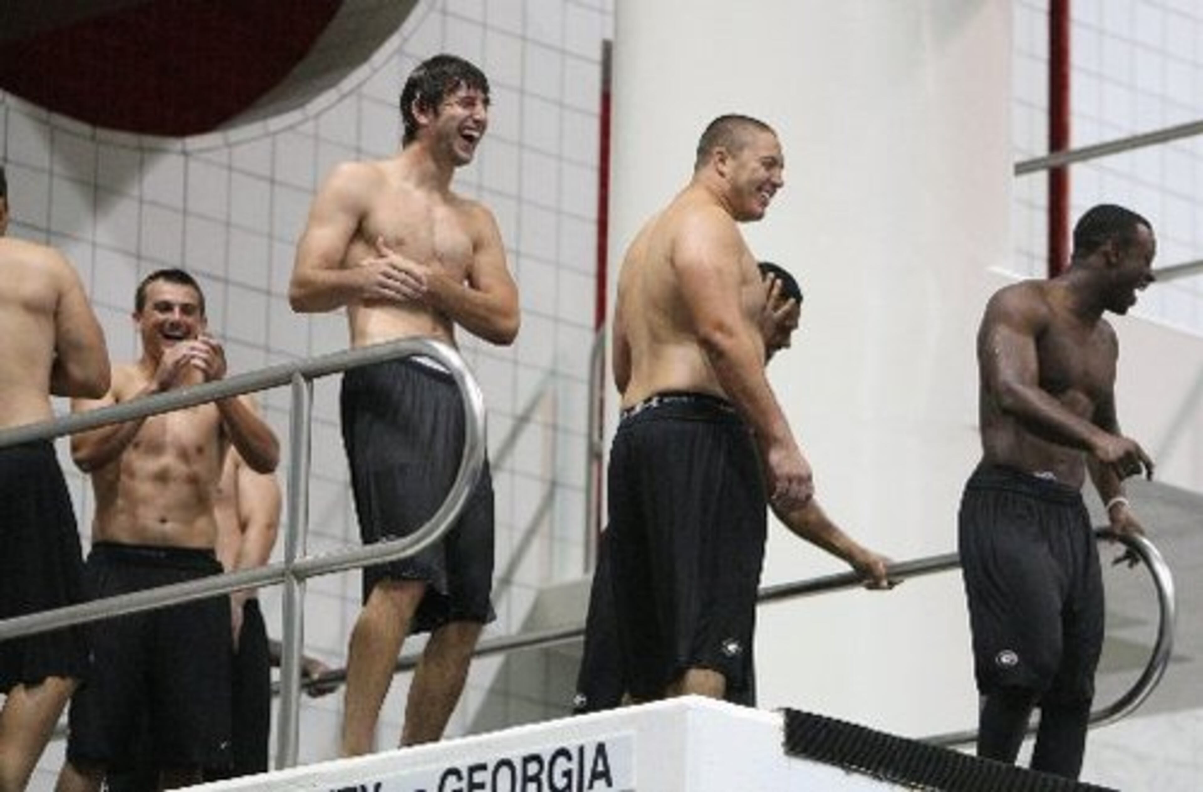 Bulldogs (L-R) Blair Walsh, Kris Durham, Brandon Wheeling and Sanders Commings laugh at a teammate's hard landing from the 10-meter platform.