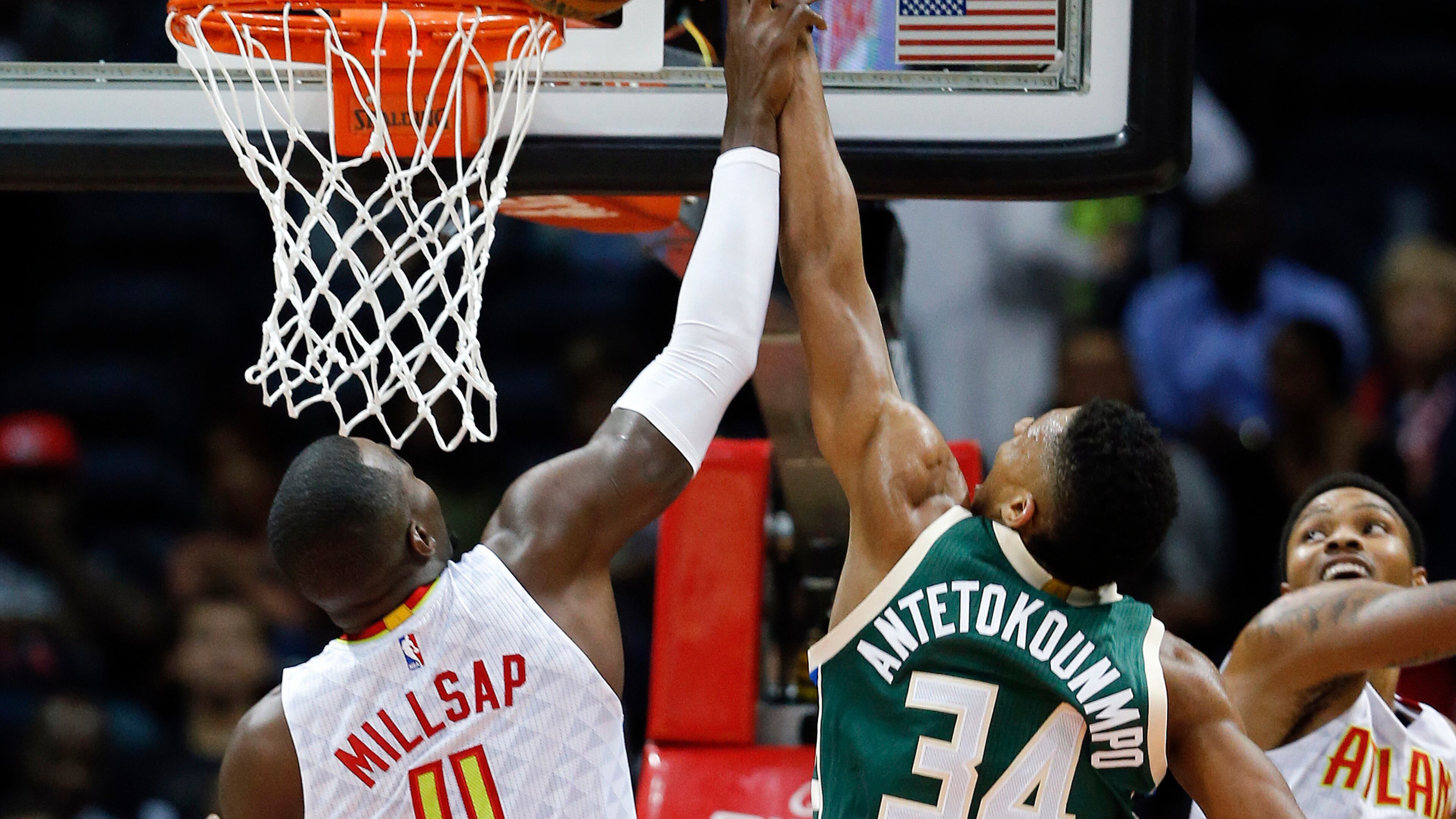 Bucks forward Giannis Antetokounmpo (34) has his shot blocked by Hawks forward Paul Millsap (4) in the first half of an NBA basketball game Wednesday, Nov. 16, 2016, in Atlanta. (AP Photo/John Bazemore)