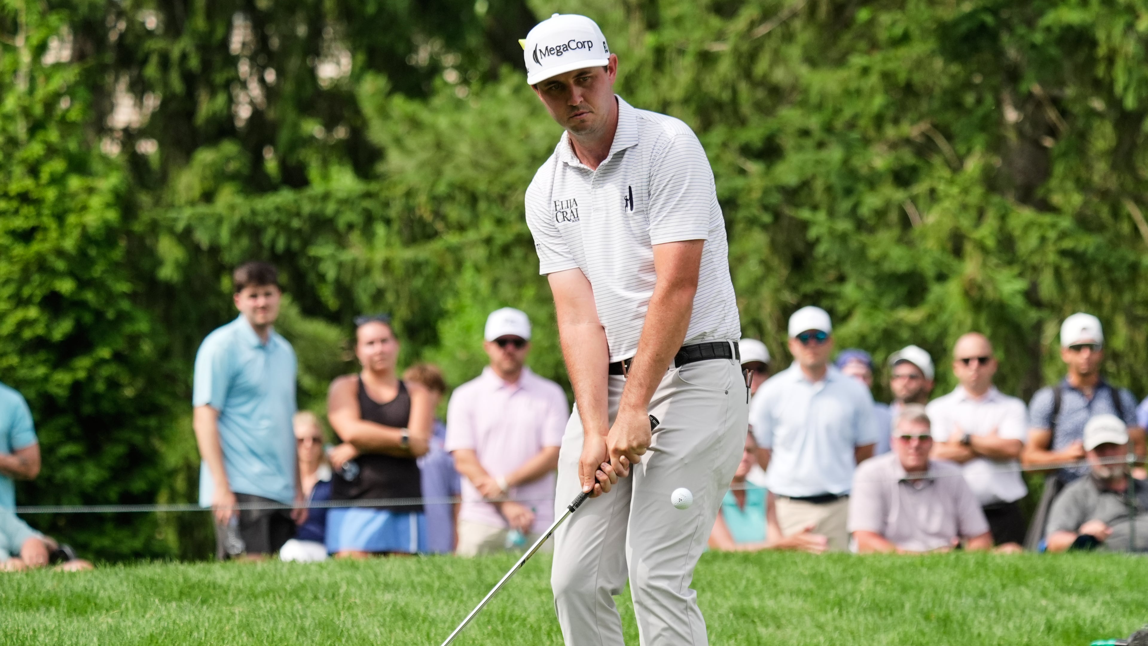 J.T. Poston chips onto the sixth green during the third round of the Memorial golf tournament, in Dublin, Ohio, Saturday, June 6, 2026. (AP Photo/Sue Ogrocki)