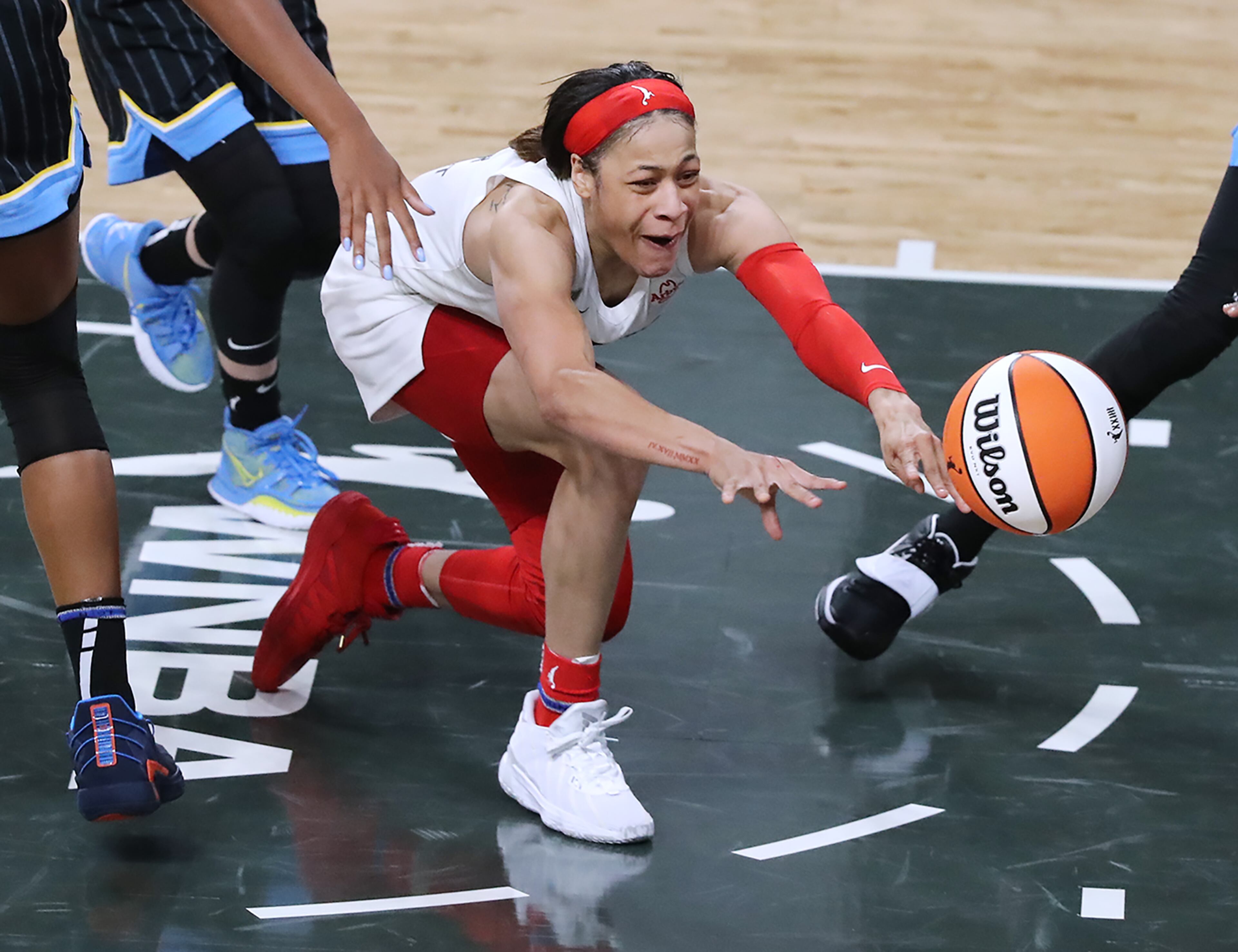 Atlanta Dream guard Chennedy Carter gets off a pass under pressure from Chicago Sky defenders in a WNBA basketball game on Wednesday, May 19, 2021, in College Park. “Curtis Compton / Curtis.Compton@ajc.com”