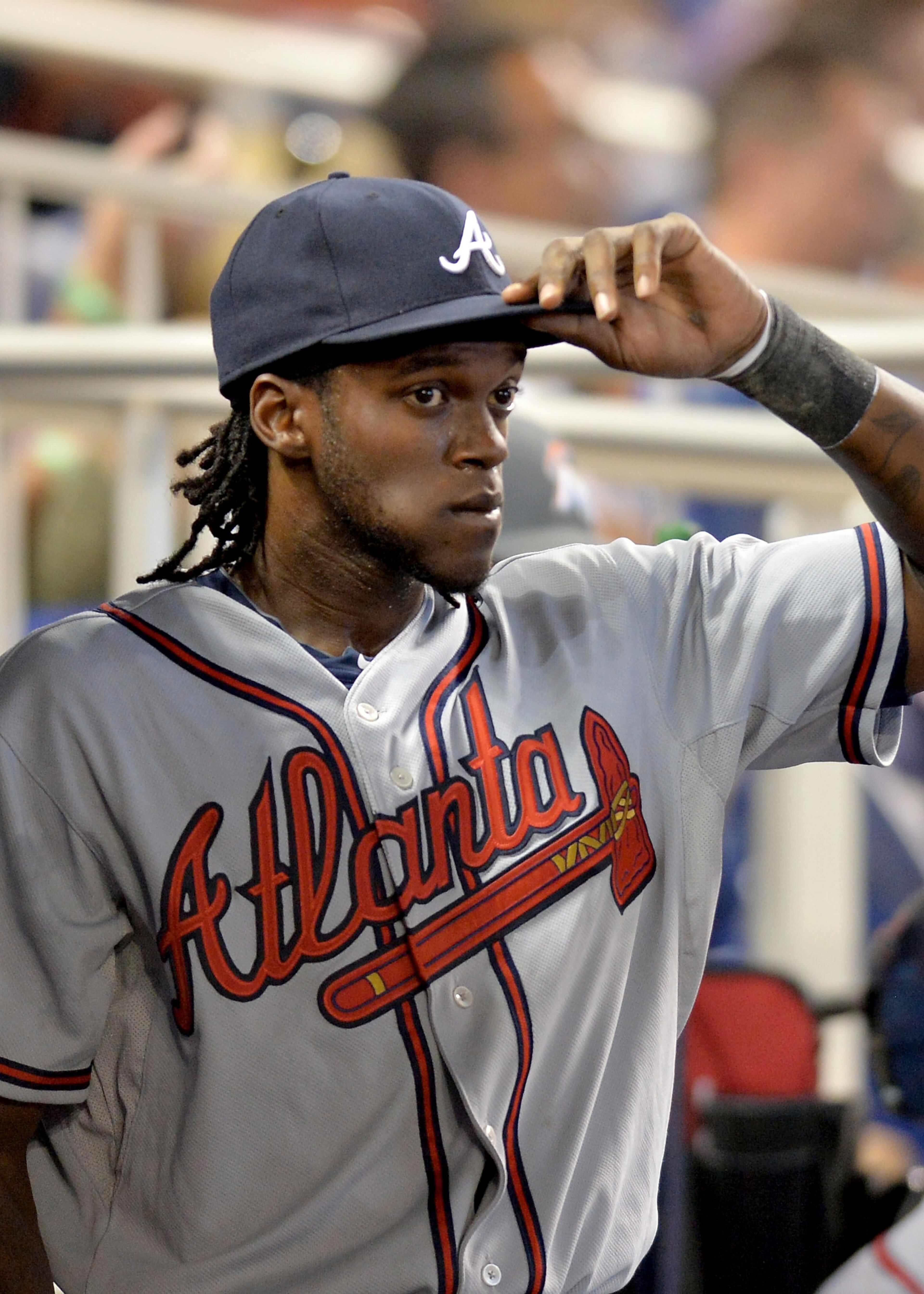 Atlanta Braves center fielder Cameron Maybin (25) looks on from the dugout during the sixth inning against the Miami Marlins at Marlins Park. The Braves won 2-1. Mandatory Credit: Steve Mitchell-USA TODAY Sports