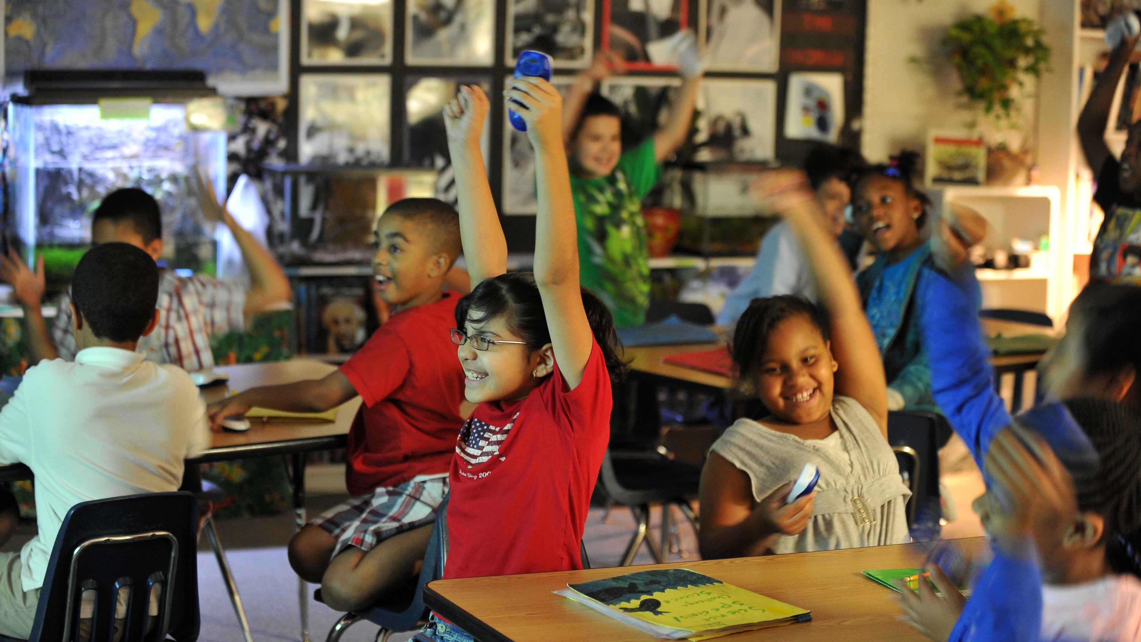 Students at Lilburn Elementary School celebrate after choosing the correct answer during an interactive science lesson in this file photo. Elementary students make up almost 45 percent of Gwinnett County students.