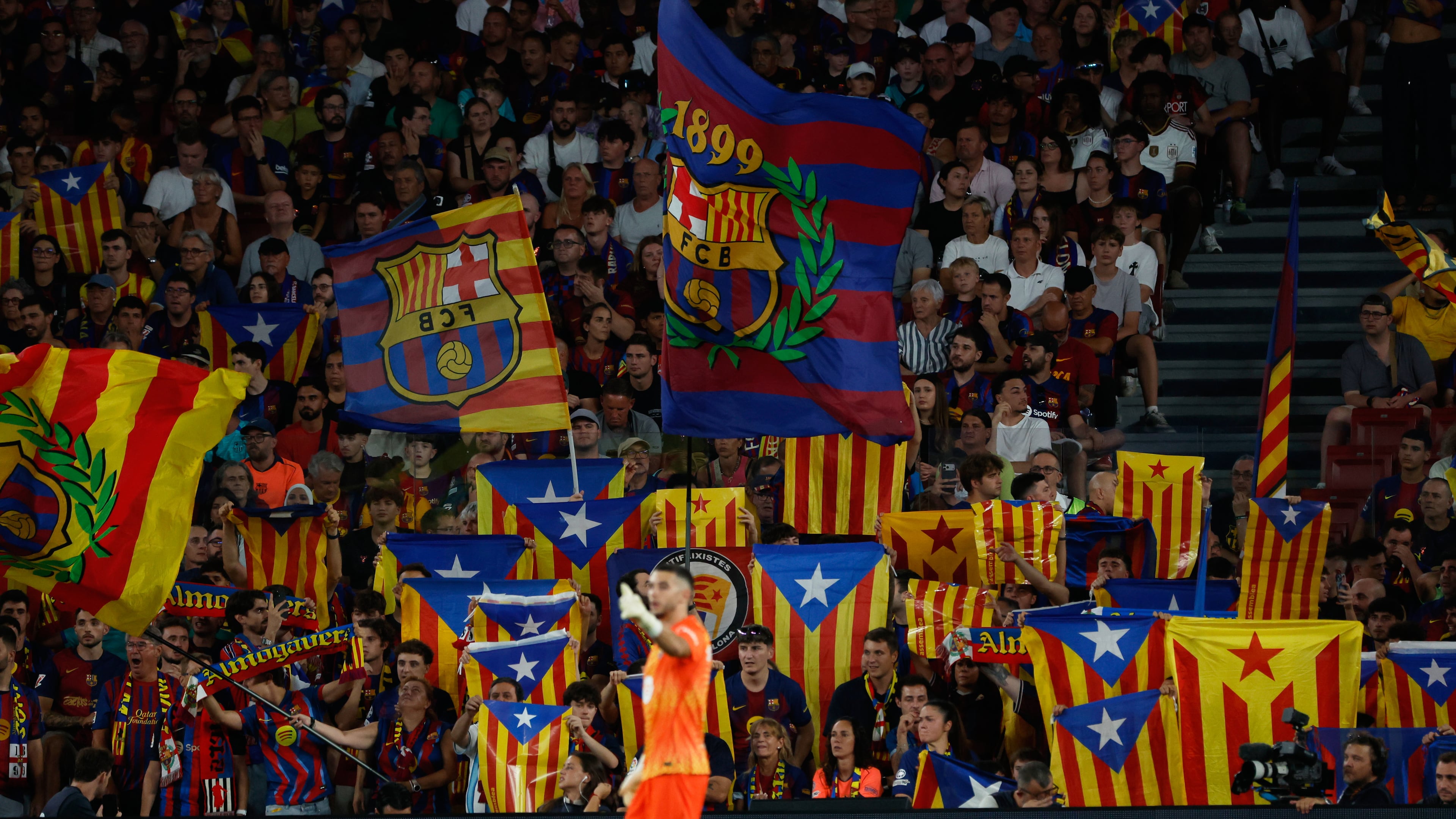Supporters lift independence flags during a Spanish La Liga soccer match between Barcelona and Athletic in Barcelona, Spain, Thursday, Aug. 27, 2026. (AP Photo/Joan Monfort)