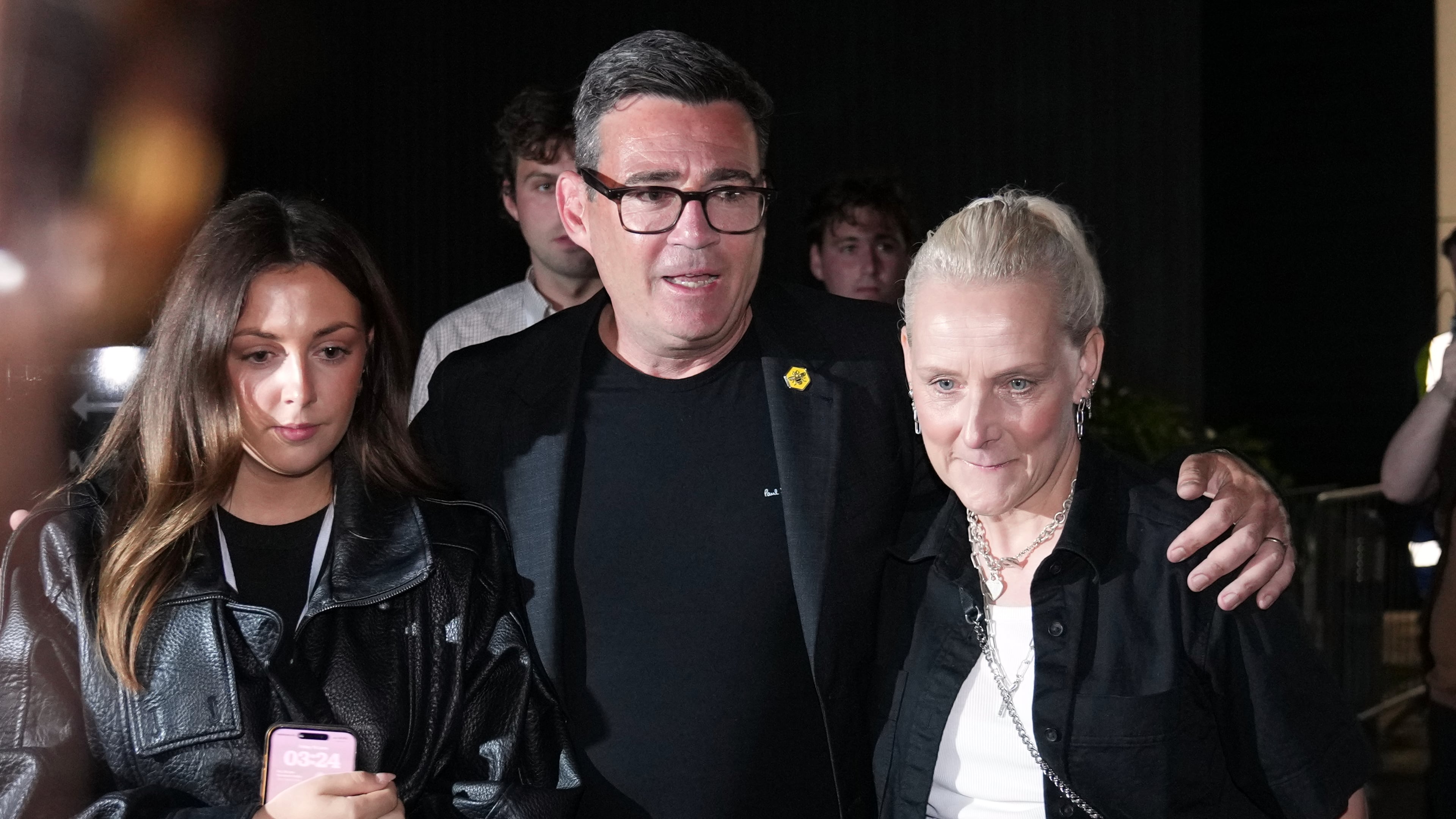 Britain's Labour party's Andy Burnham leaves with his wife Marie-France Van Heel and their daughter Rosie after winning the Makerfield by-election, paving the way for a leadership challenge against Prime Minister Sir Keir Starmer. in Wigan, England, Friday, June 19, 2026.(AP Photo/Jon Super)