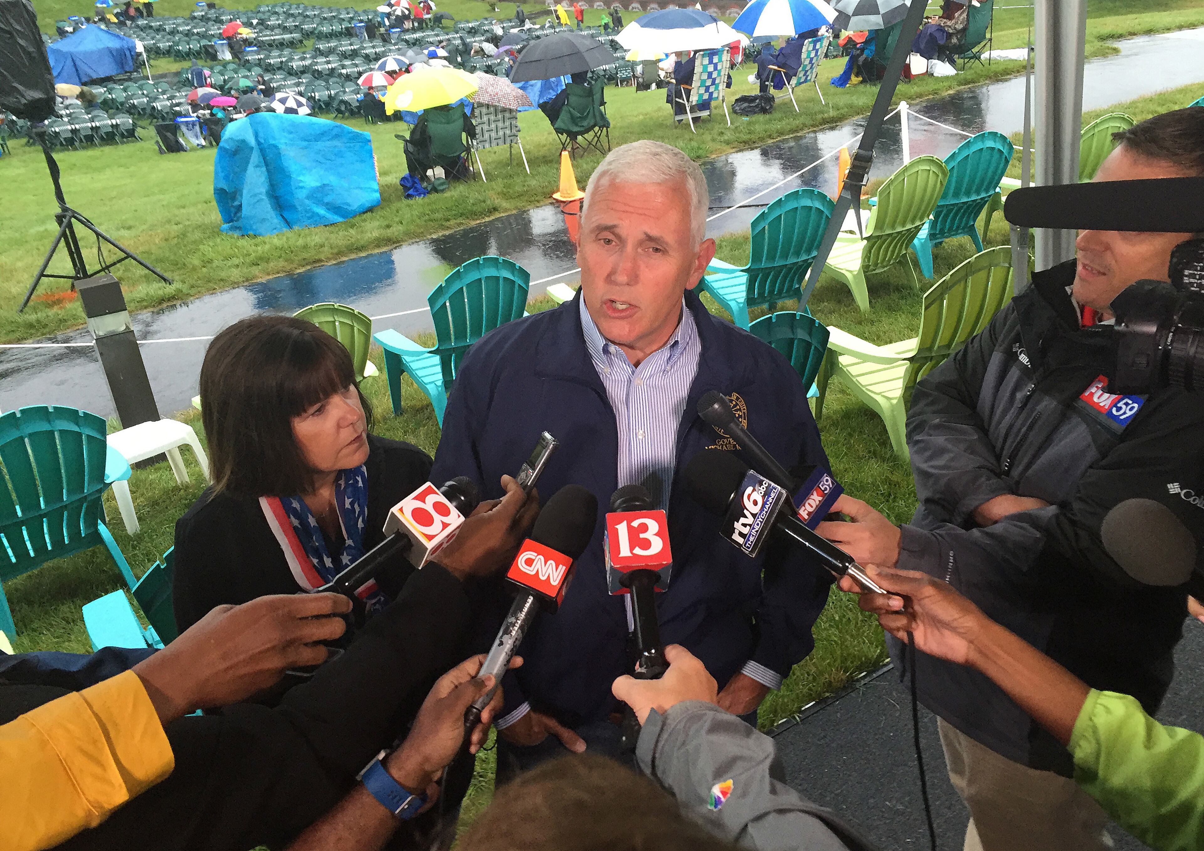 In this July 3, 2016, file photo, Indiana Gov. Mike Pence speaks during a news conference before attending Symphony on the Prairie for a Fourth of July concert in Fishers, Ind. Pence is one of several Republicans Trump is considering for his vice presidential running mate. Trump is expected to announce his decision on Friday. (AP Photo/Michael Conroy, File)