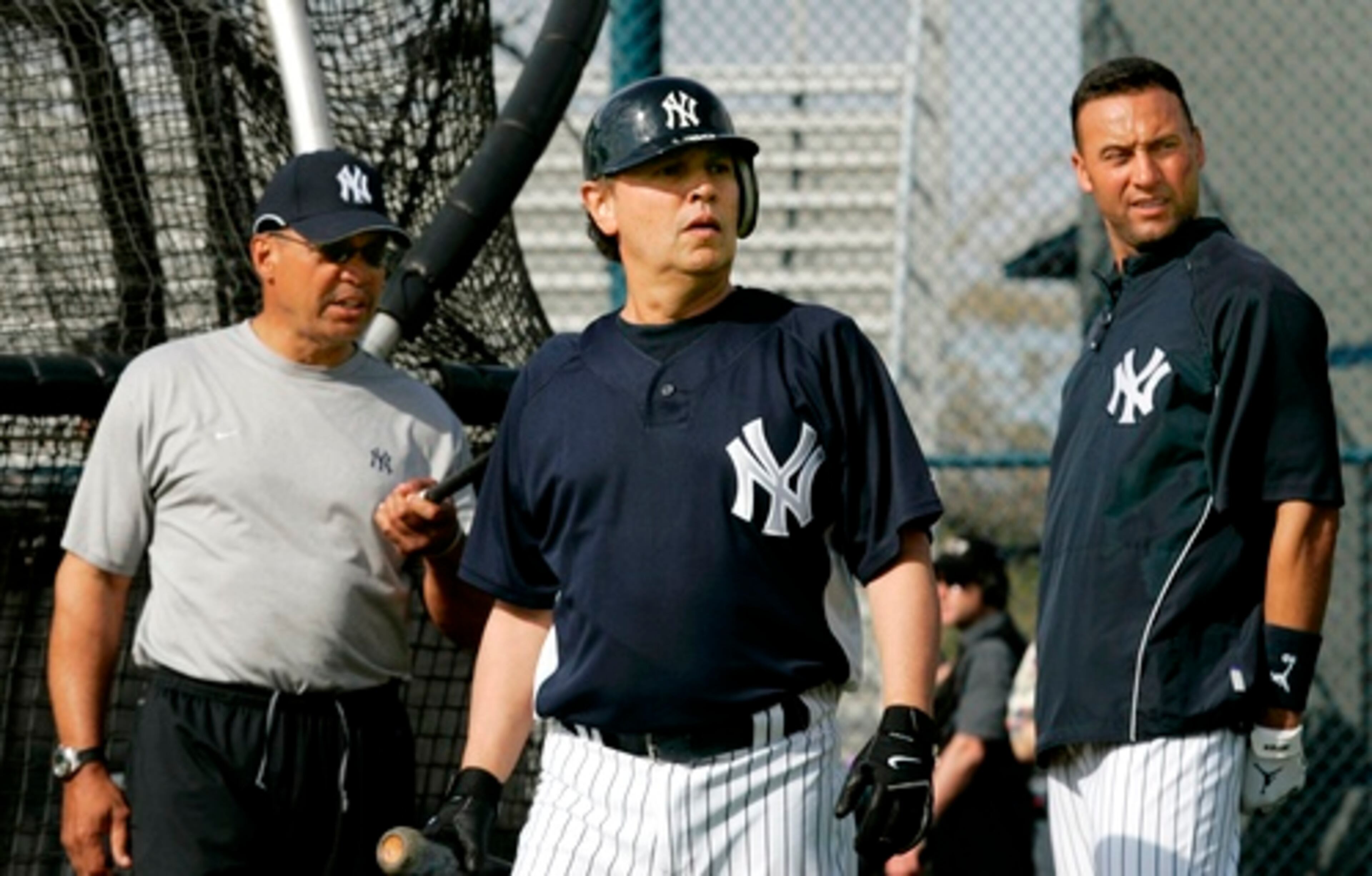 Yankees special adviser Reggie Jackson, left, and shortstop Derek Jeter stand by the batting cage with Crystal before Wednesday's workout.