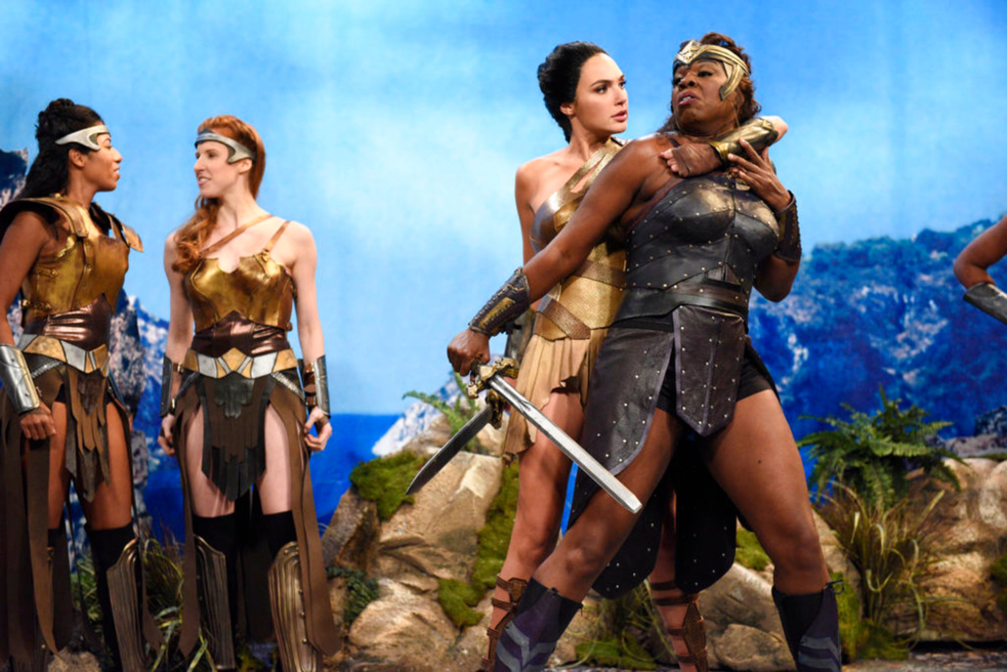 This image released by NBC shows Gal Gadot, center, and Leslie Jones, right during a sketch on "Saturday Night Live." Jones was nominated Thursday for an Emmy for outstanding supporting actress in a comedy series. The 70th Emmy Awards will be held on Monday, Sept. 17. (Will Heath/NBC via AP)