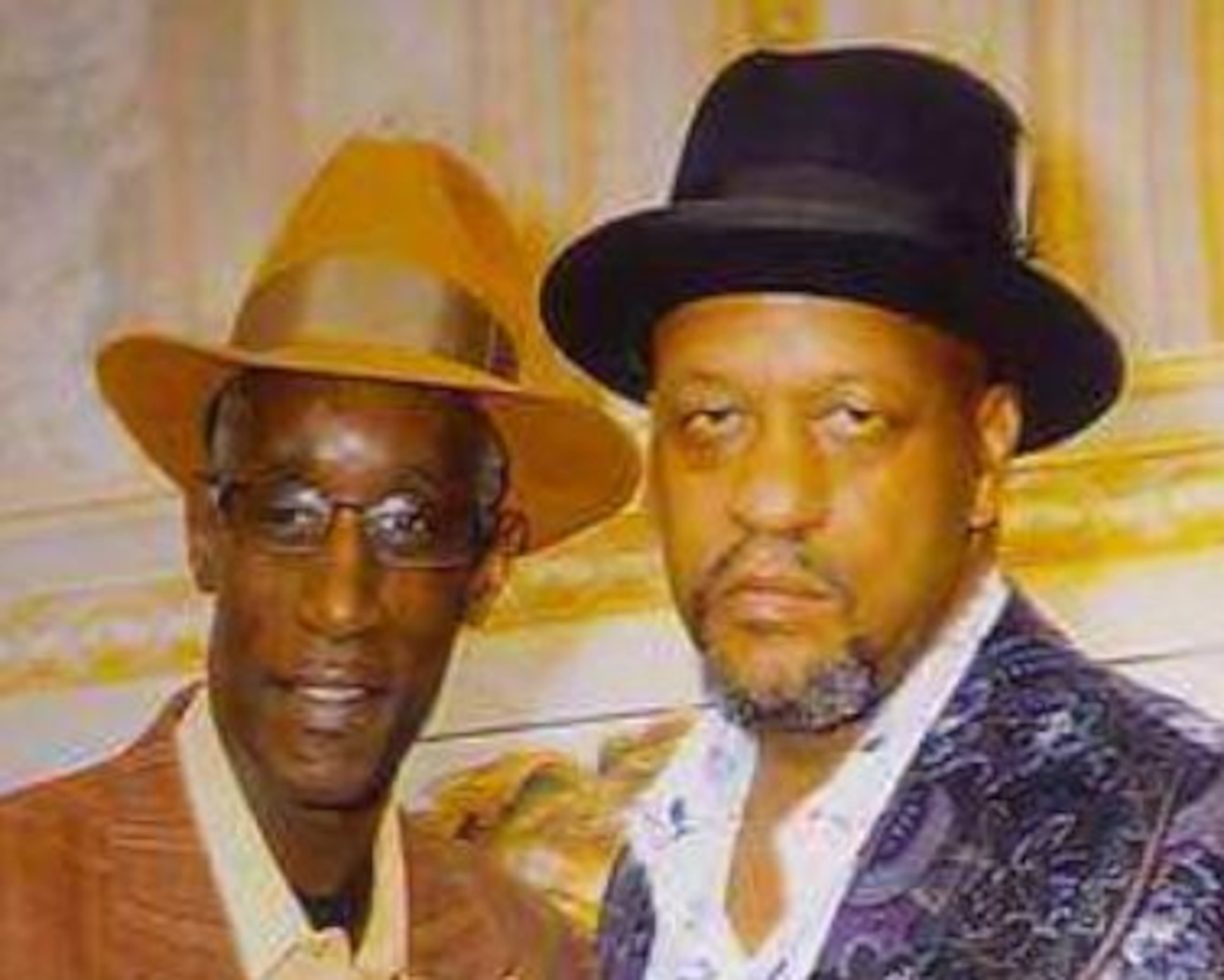 Lamont Walker (right) with his friend, Sam White, who was killed by gang members. (Special to the AJC)