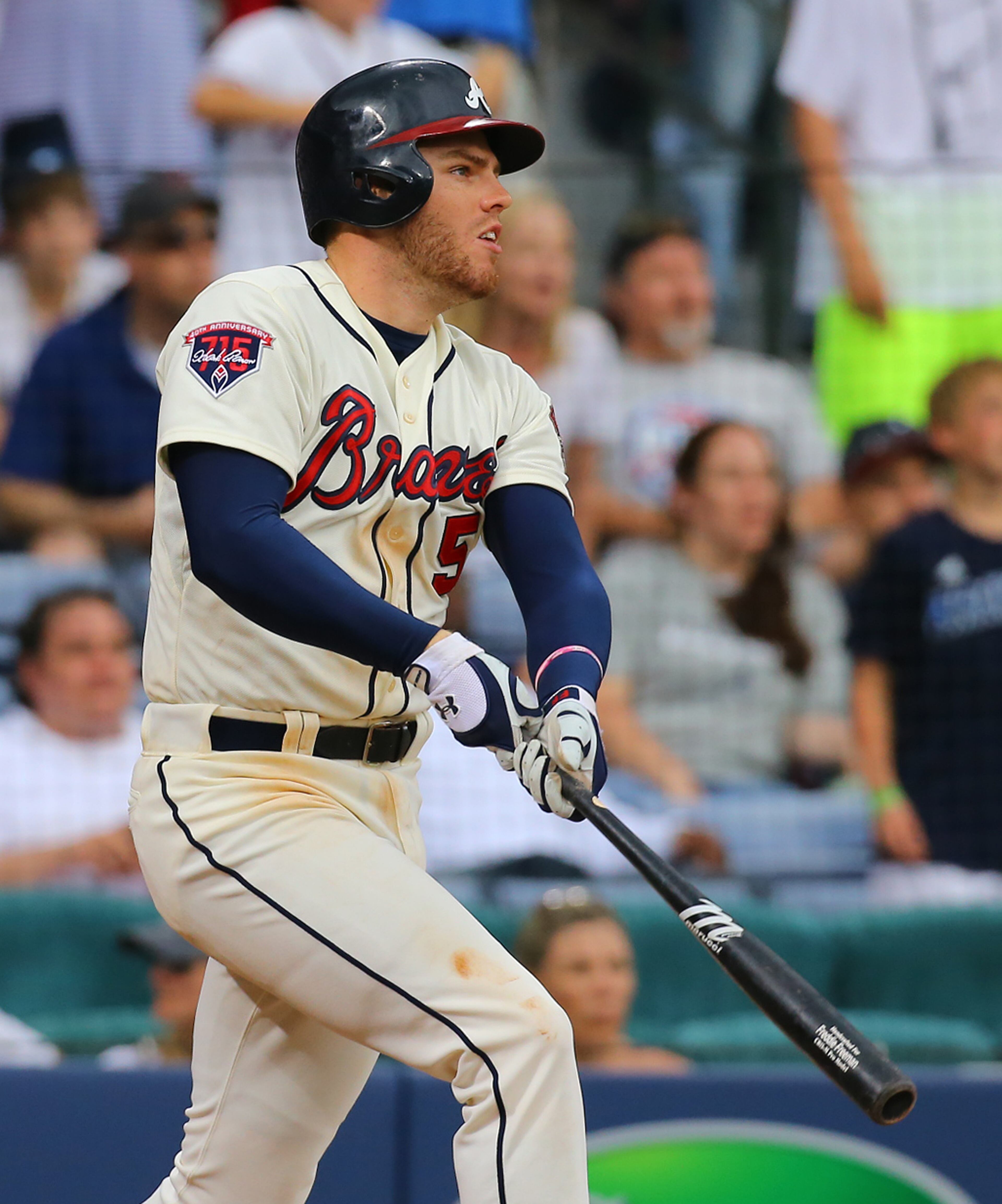 Freddie Freeman hits a game winning RBI single to beat the Reds 1-0 in the 10th inning of their MLB baseball game on Sunday, April 27, 2014, in Atlanta. CURTIS COMPTON / CCOMPTON@AJC.COM