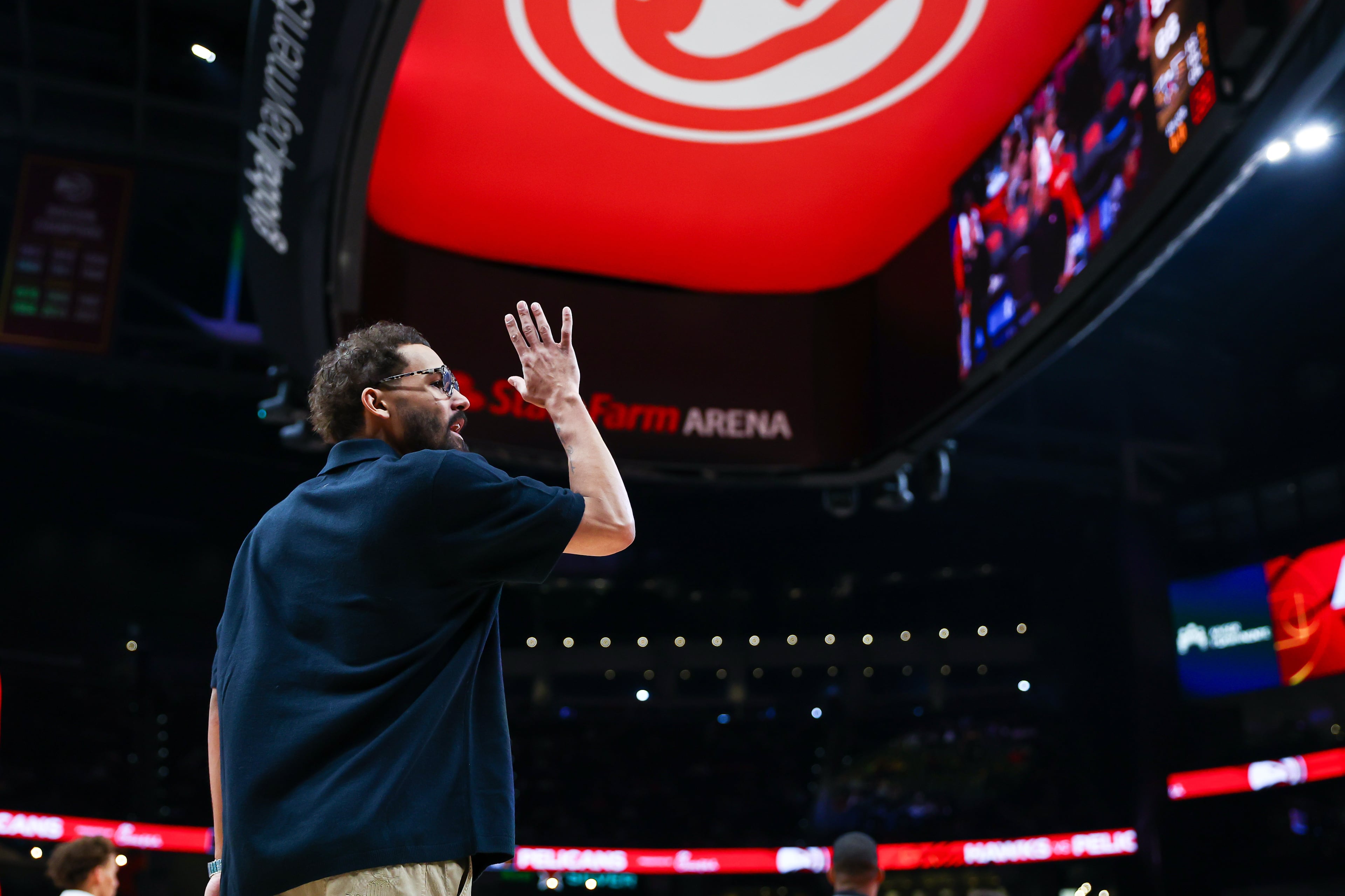 Trae Young attends Wednesday’s win over the Pelicans, the last he would watch as a member of the Hawks.