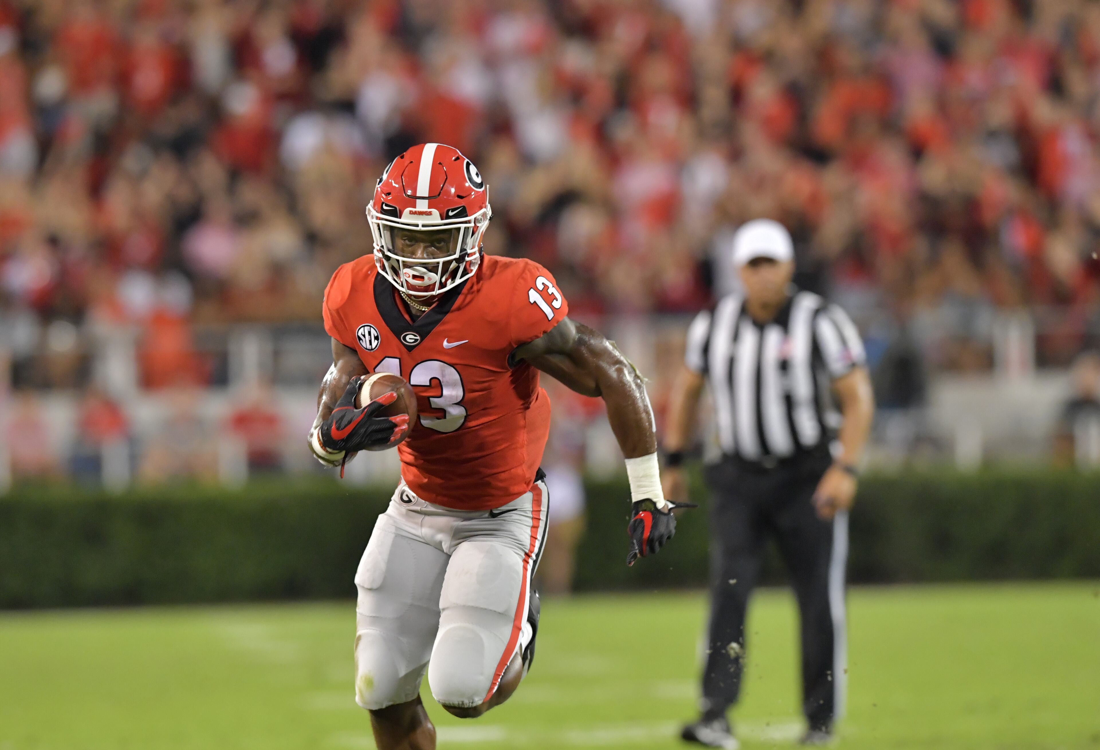 October 6, 2018 Athens - Georgia running back Elijah Holyfield (13) runs for a touchdown in the first half during a NCAA college football game at Sanford Stadium in Athens on Saturday, October 6, 2018. HYOSUB SHIN / HSHIN@AJC.COM