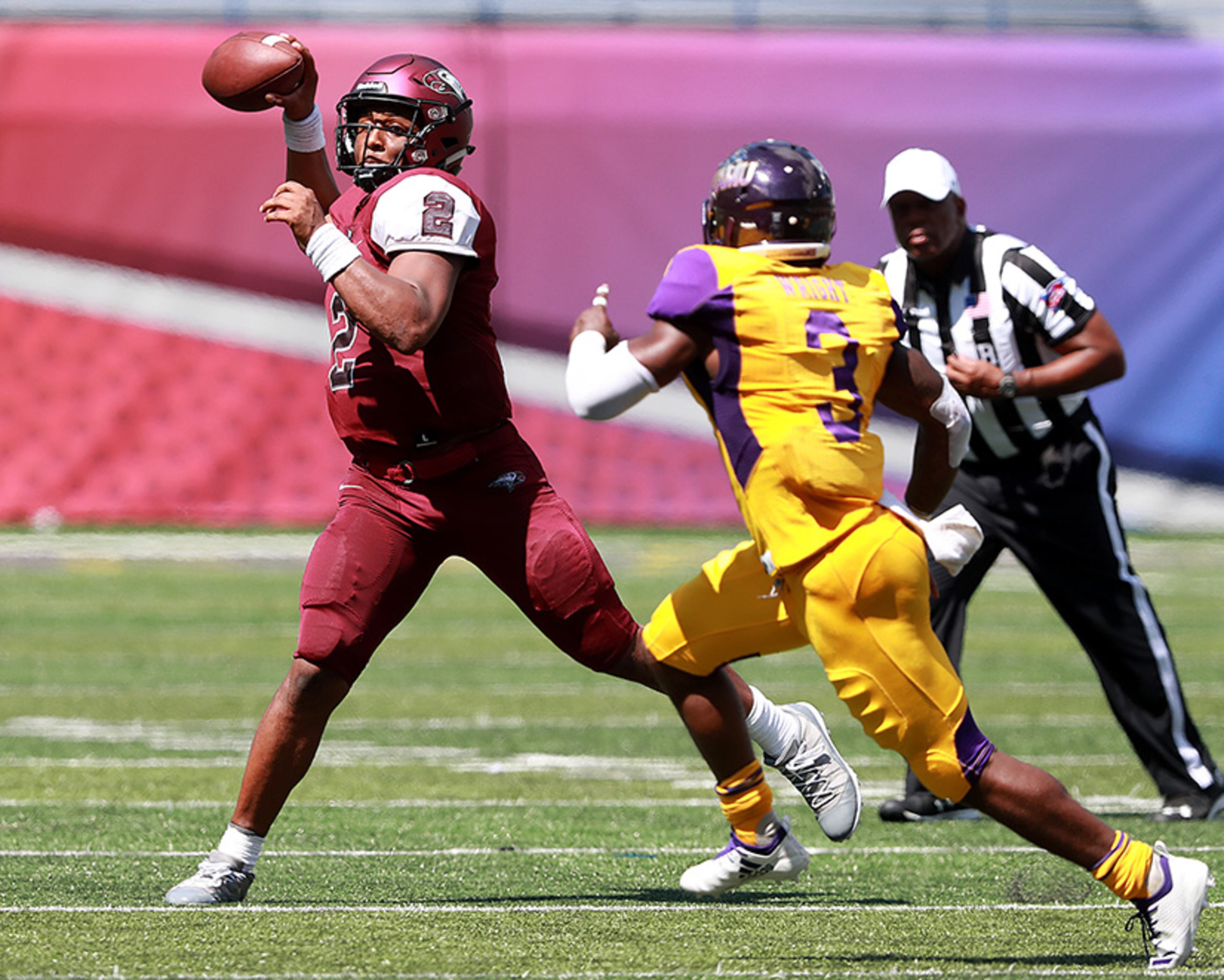 North Carolina Central quarterback Chauncey Caldwell passes under pressure from Prairie View A&M cornerback Jatece Wright during the second half of the MEAC-SWAC Challenge Sunday, Sept. 2, 2018, in Atlanta.