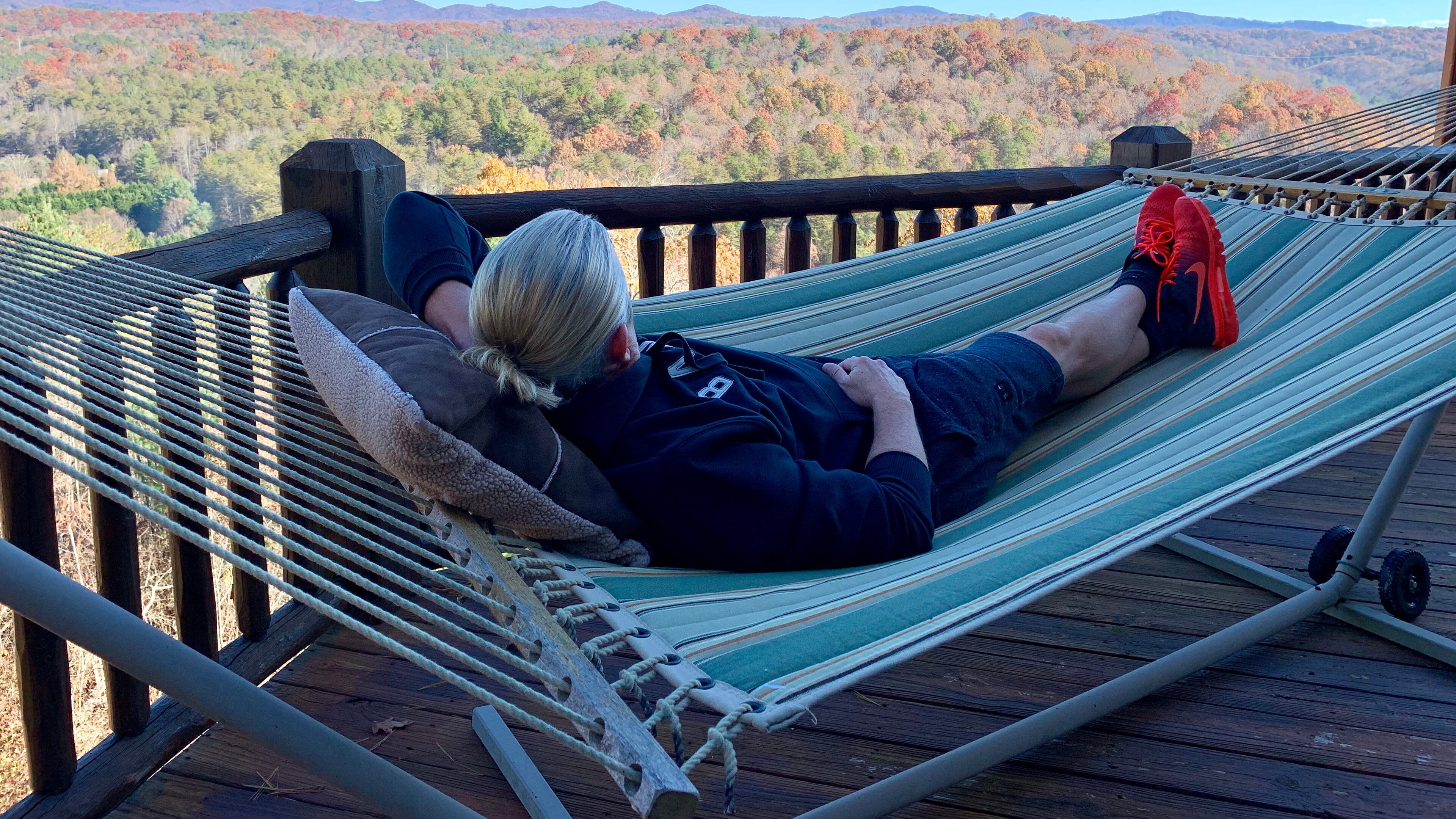 What If Cabin Airbnb host T.J. enjoys the scenic views from the porch hammock.