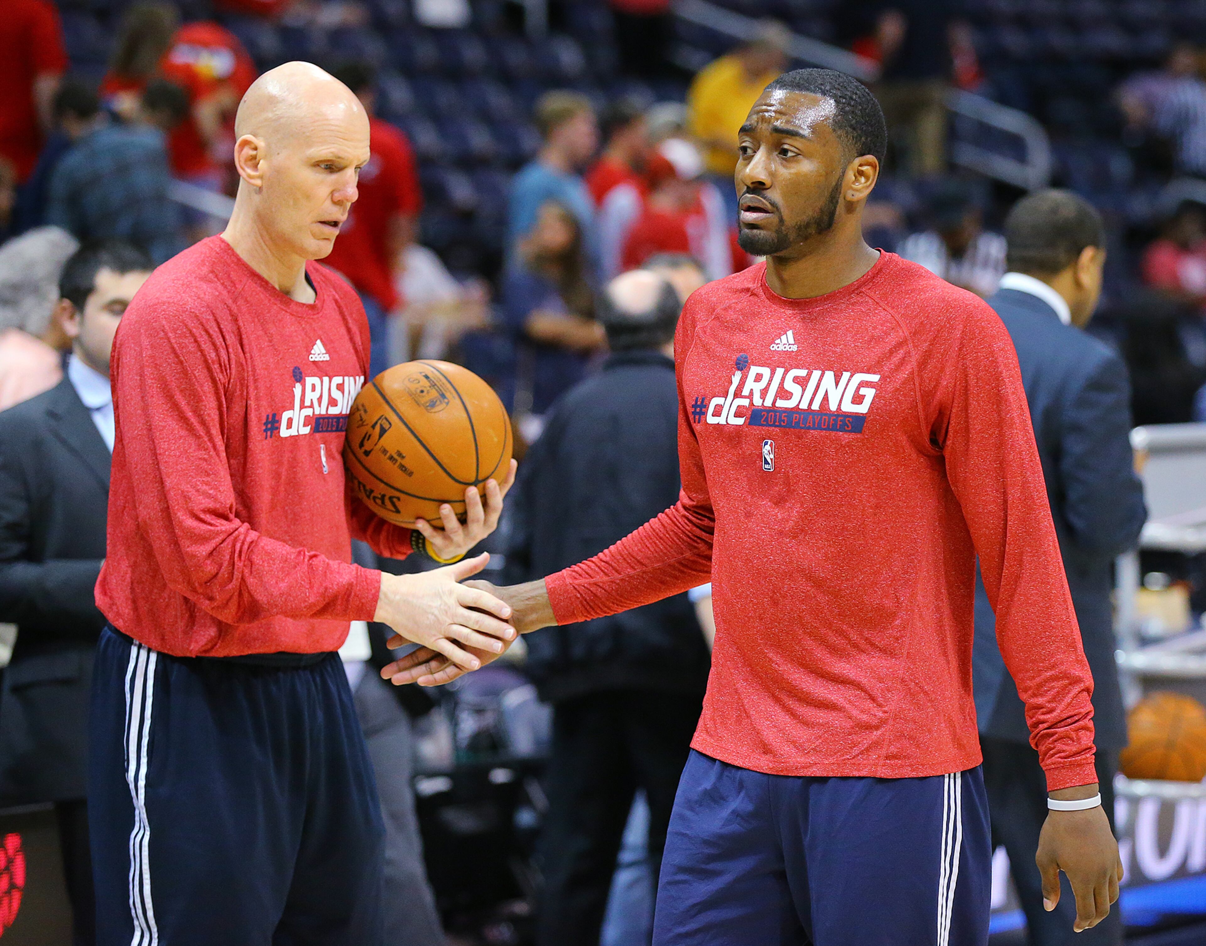 Wizards John Wall gets five from a trainer after testing his wrist with some pregame shooting before the Eastern Conference Semifinals game 5 against the Hawks on Tuesday, May 13, 2015, in Atlanta. Curtis Compton / ccompton@ajc.com