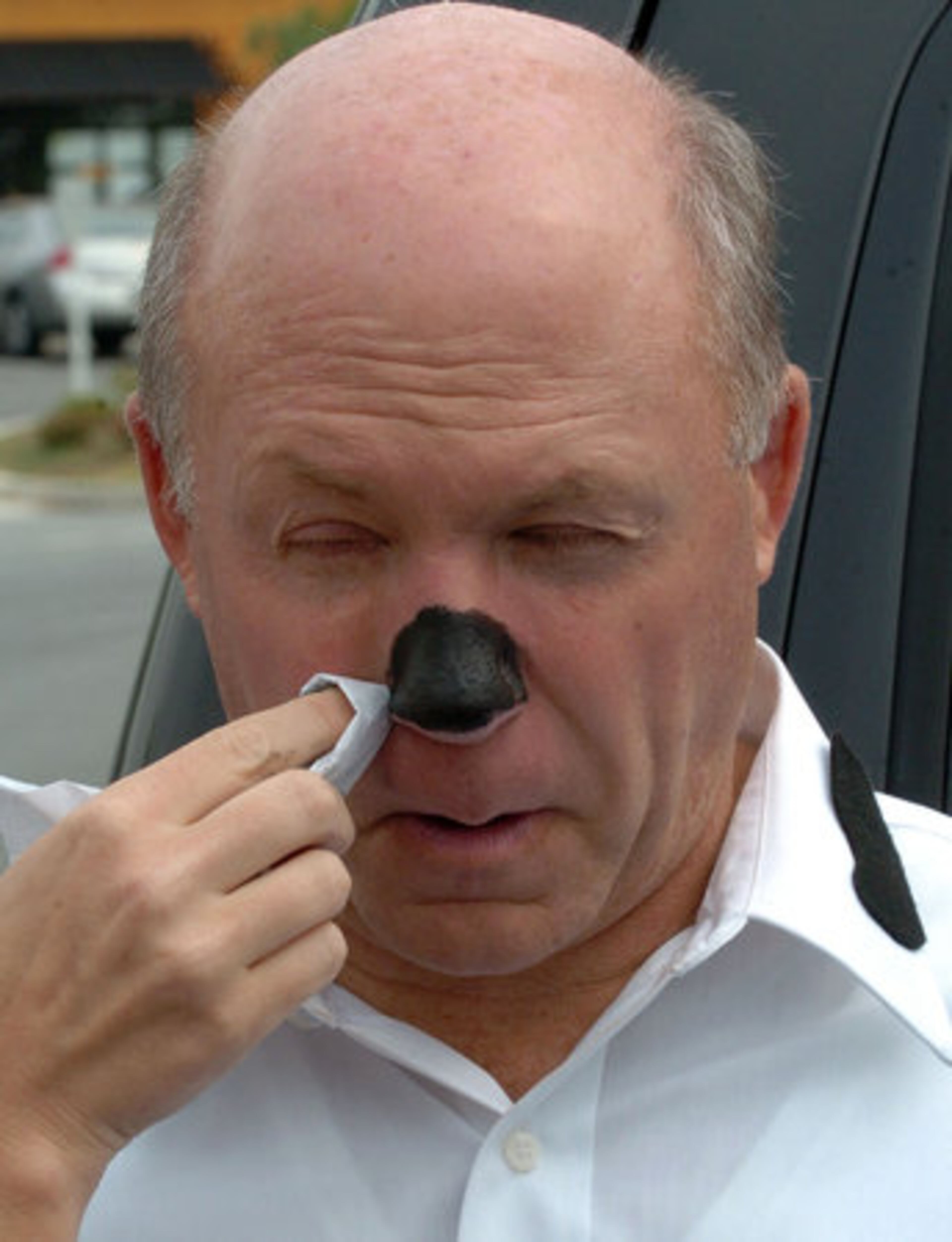 Dan Cathy gets help with his cow makeup. His father has built a light-hearted element into the company culture, he said. "He taught us: Don't take yourself too seriously," Dan Cathy said. "Learn to have fun. Be approachable."