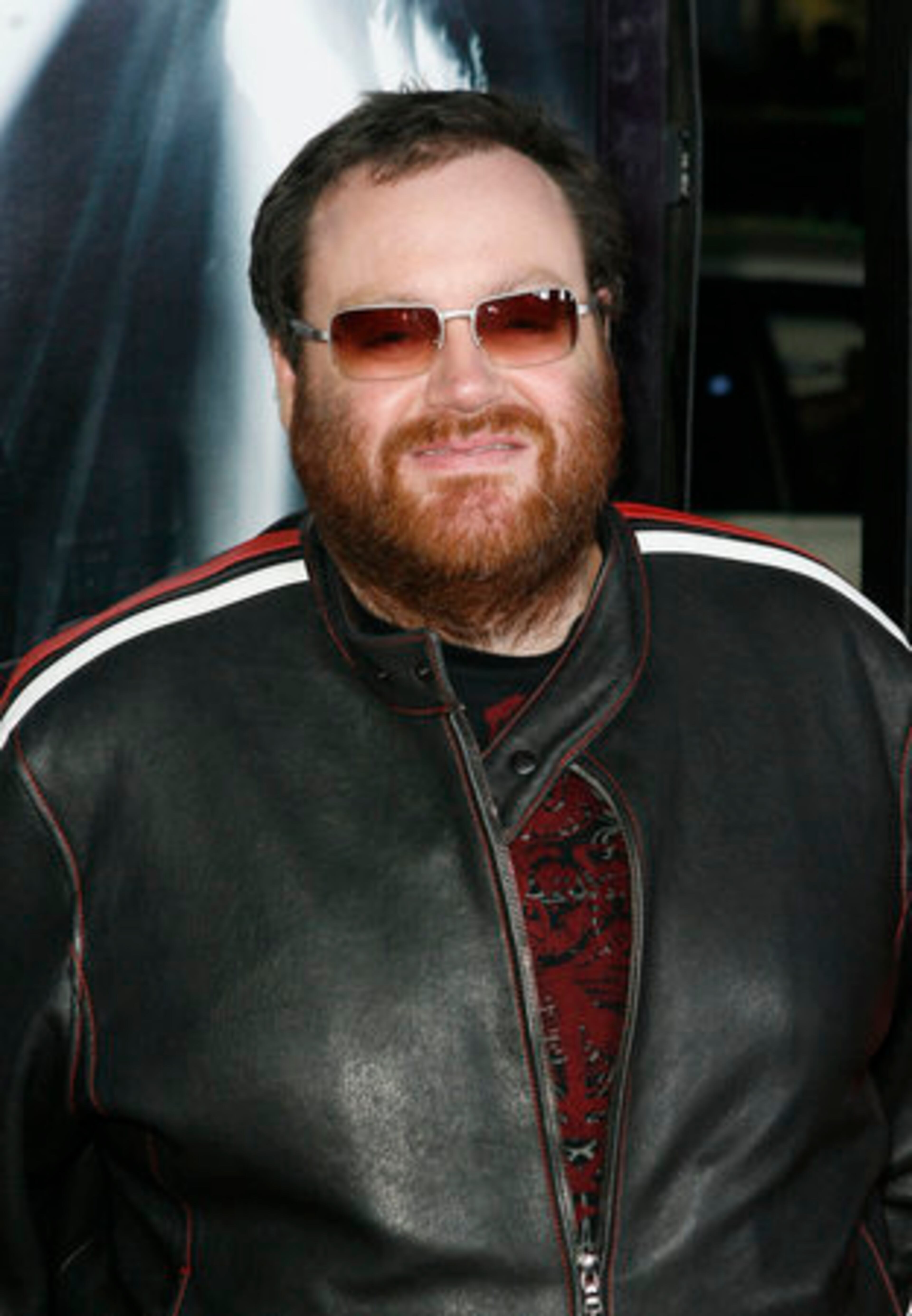 Director John Moore arrives. Moore also directed "Behind Enemy Lines" and "Flight of the Phoenix."