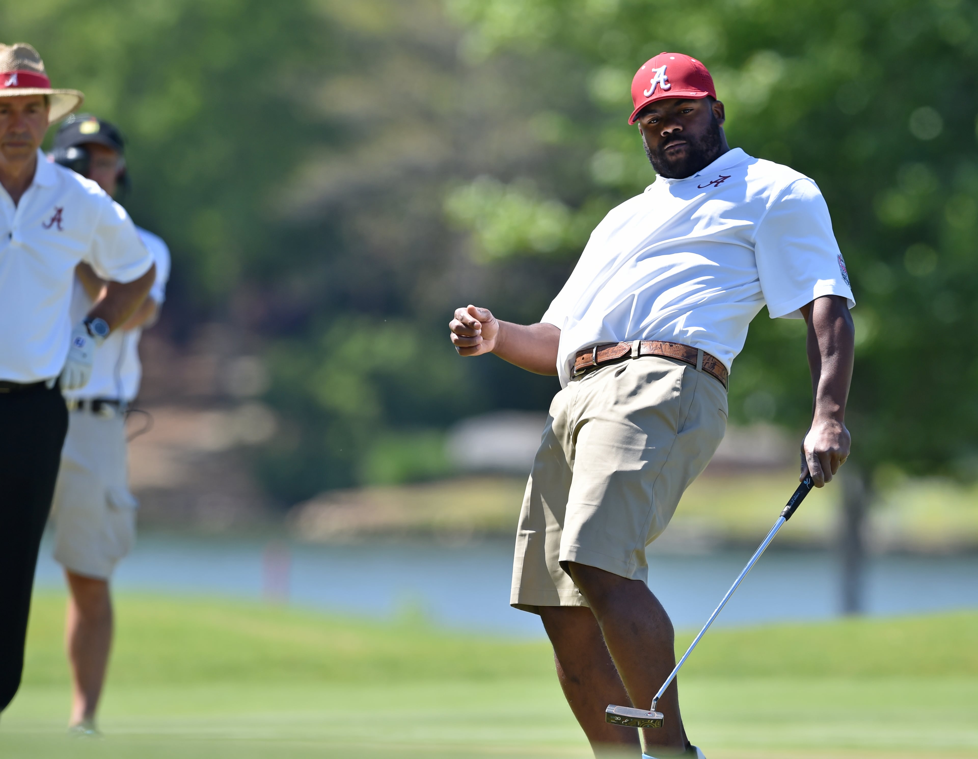 Alabama Heisman Trophy winner Mark Ingram reacts to his putt on the 18th hole during the Chick-fil-A Peach Bowl Challenge at Reynolds Plantation. Ingram and Alabama head coach Nick Saban lost to Georgia Tech head coach Paul Johnson and his playing partner Jon Berry after a four-hole playoff. The event features NCAA head coaches and former athletes and celebrities from the same school competing against their rivals for a share of a $520,000 scholarship purse. BRANT SANDERLIN/BSANDERLIN@AJC.COM