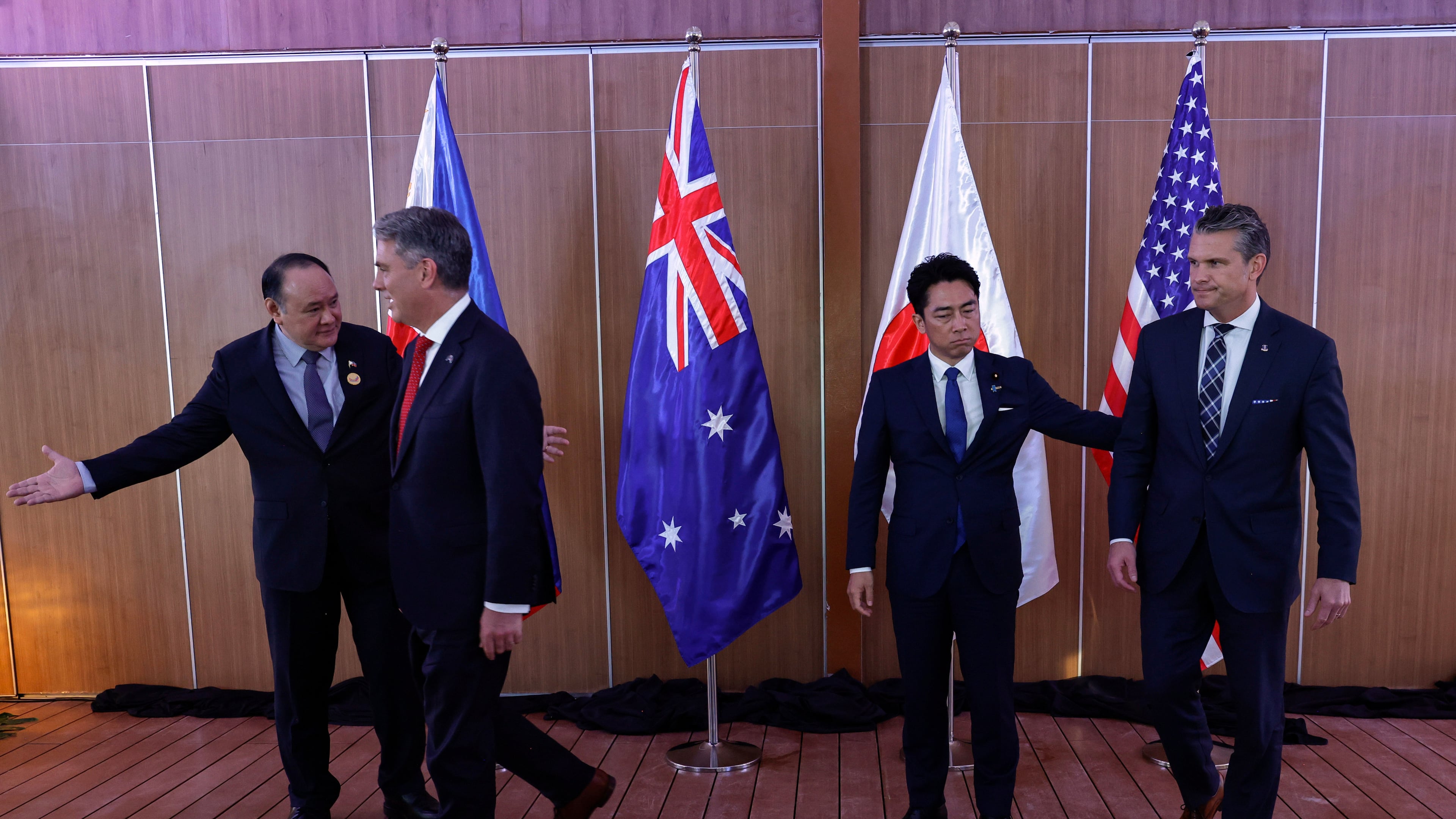 From left, Philippines Defense Secretary Gilberto Teodoro, Australia Defense Minister Richard Marles, Japan Defense Minister Shinjiro Koizumi and U.S.Defense Secretary Pete Hegseth prepare to leave after posing for pictures before holding a Quadrilateral Meeting on the sidelines of the 20th Association of Southeast Asian Nations (ASEAN) Defence Ministers' Meeting (ADMM) and 13th ADMM-Plus Meetings in Cebu, Philippines, Wednesday, Oct. 28, 2026. .(Rolex Dela Pena/Pool Photo via AP)