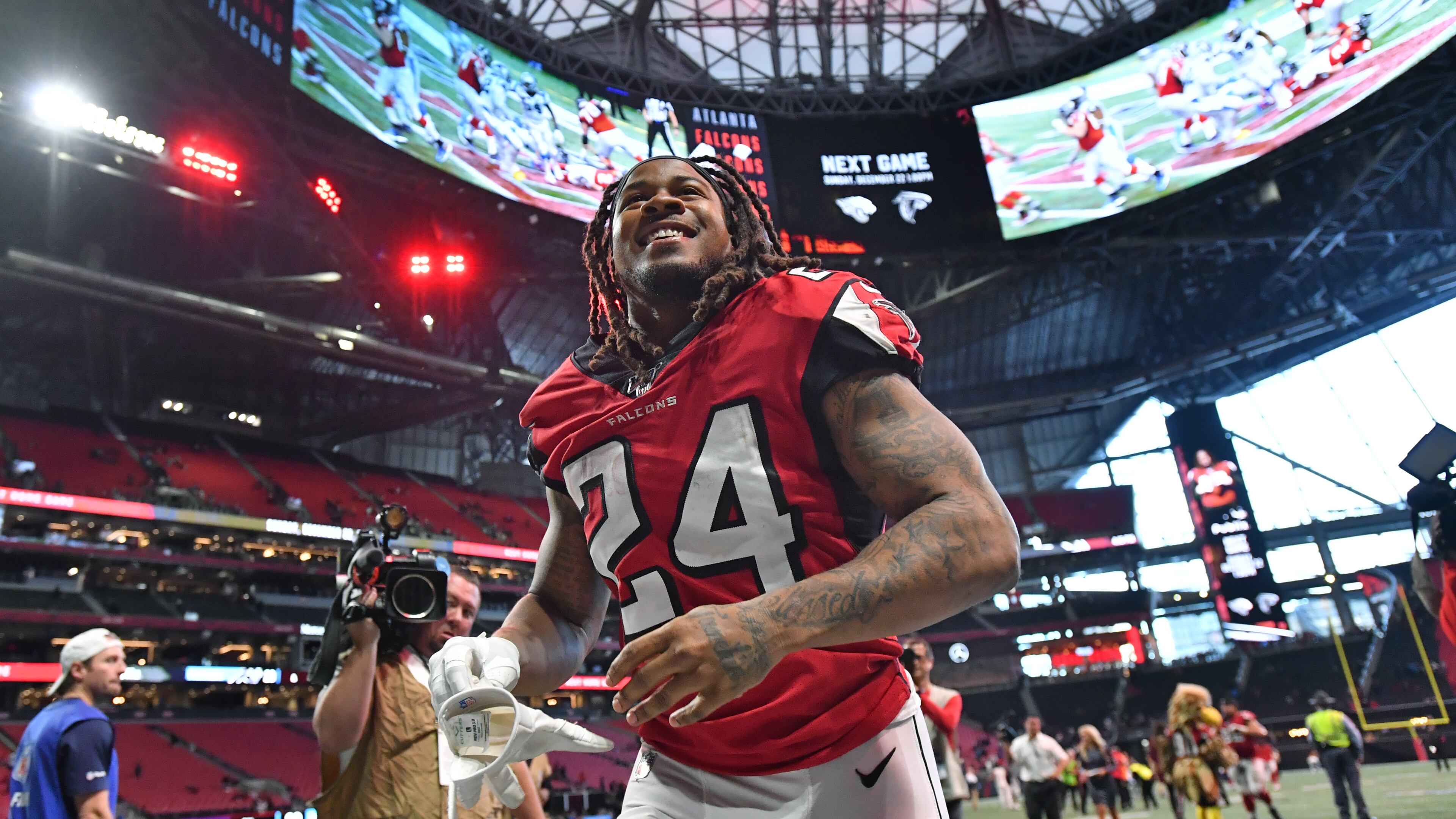 The man could light up a room: Here the Falcons Devonta Freeman leaves happy after beating Carolina. (Hyosub Shin / Hyosub.Shin@ajc.com)