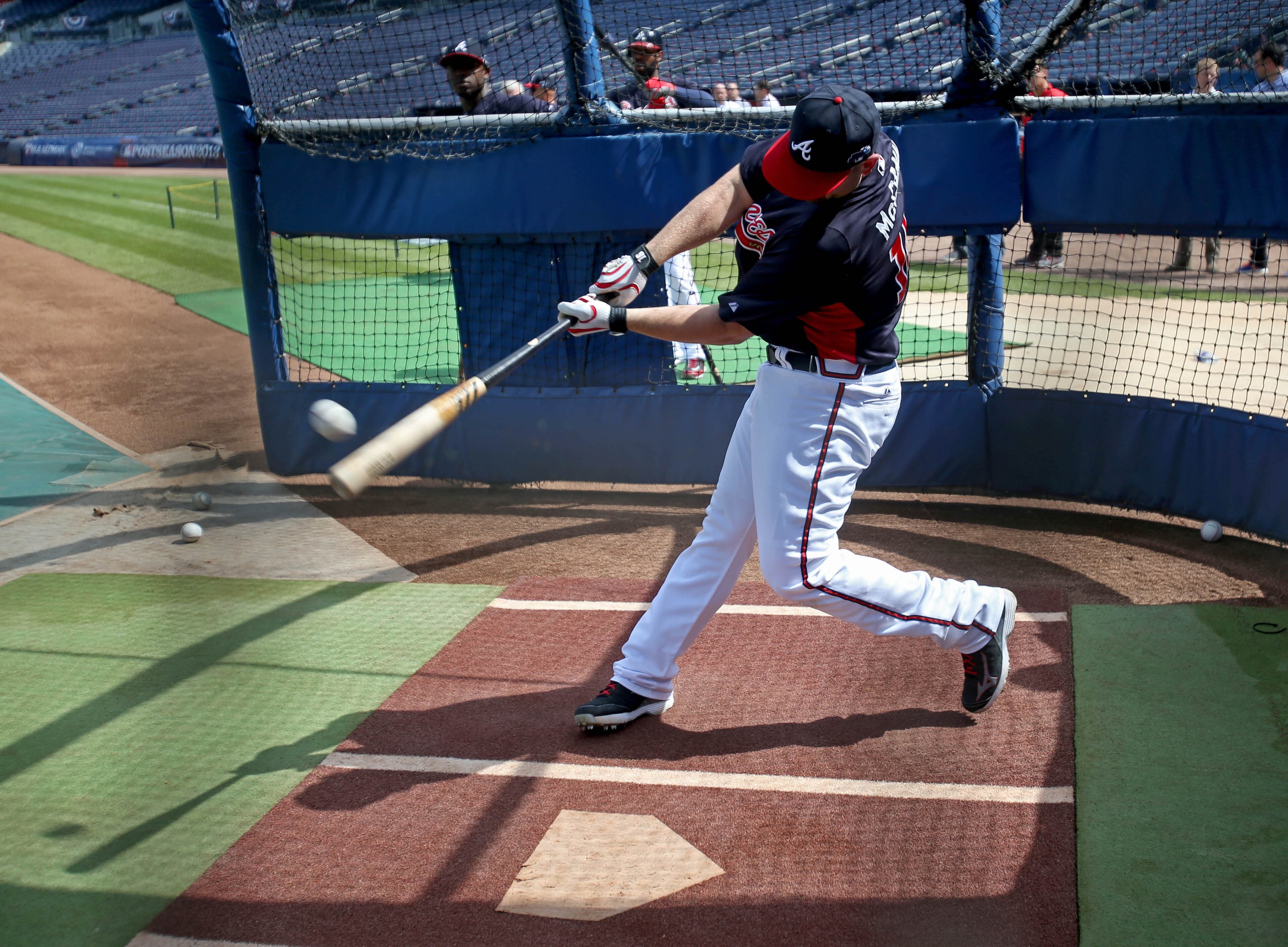 Atlanta Braves catcher Brian McCann hits a ball during batting practice in preparation for their NL Division Series against the Los Angeles Dodgers at Turner Field in Atlanta, Ga., October 2, 2013. The Atlanta Braves host the Los Angeles Dodgers in game 1 of the NL Division Series Thursday October 3, 2013 at 8:37pm.