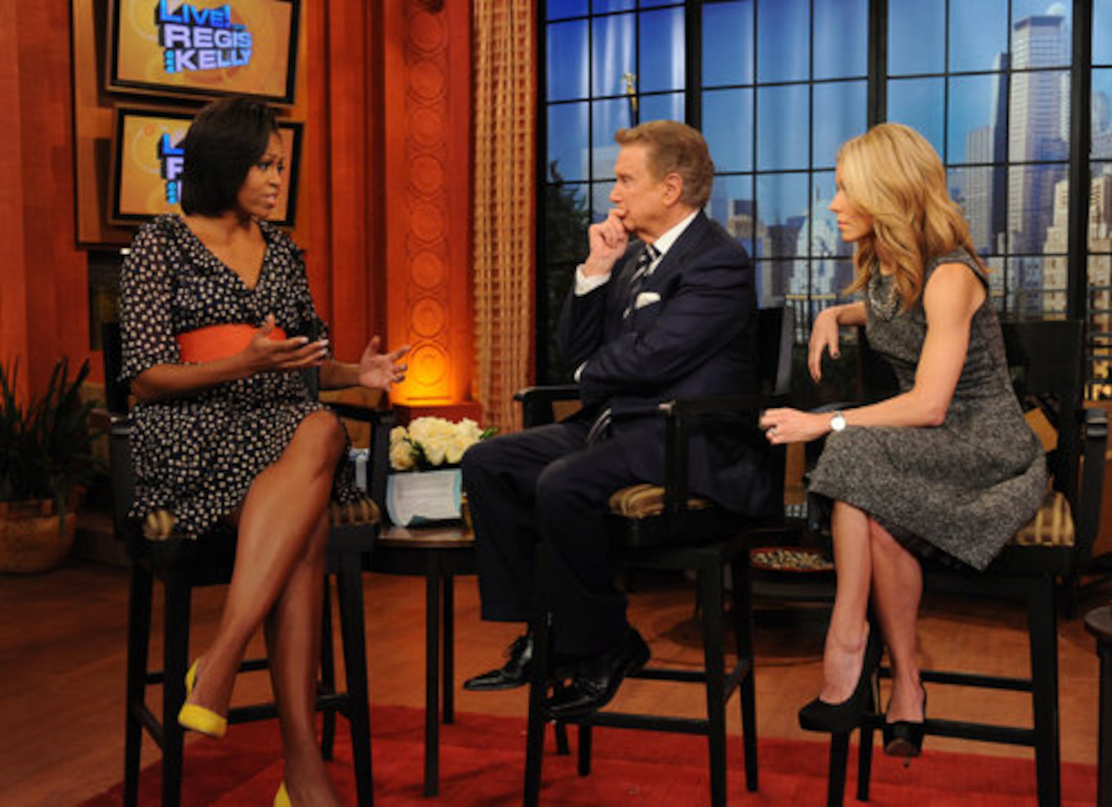 Before coming to Atlanta on Wednesday, Michelle Obama made an appearance on the "Live! with Regis and Kelly, " TV show. Here, she talks with co-hosts Regis Philbin (center) and Kelly Ripa.