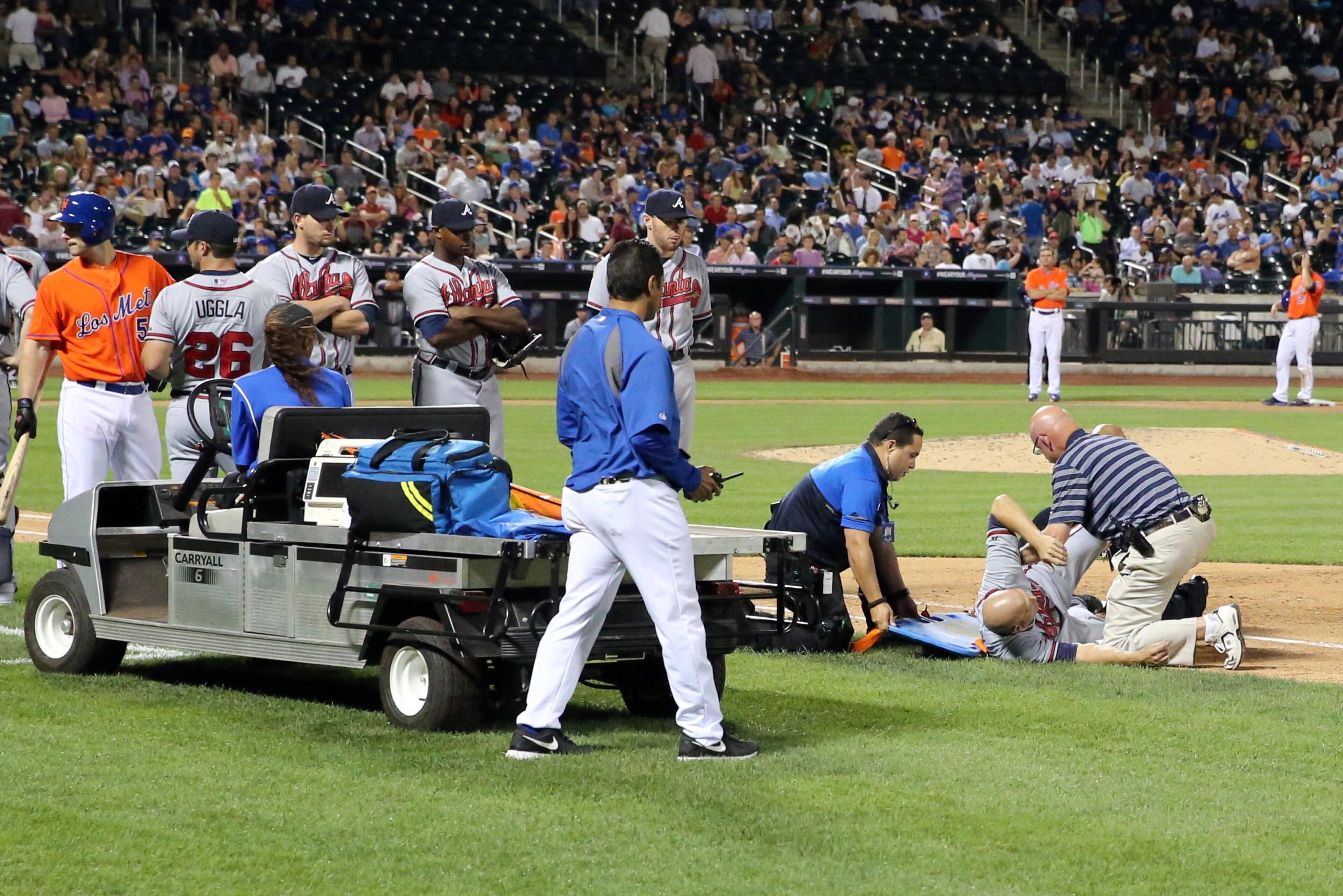 Hudson is loaded onto the stretcher.