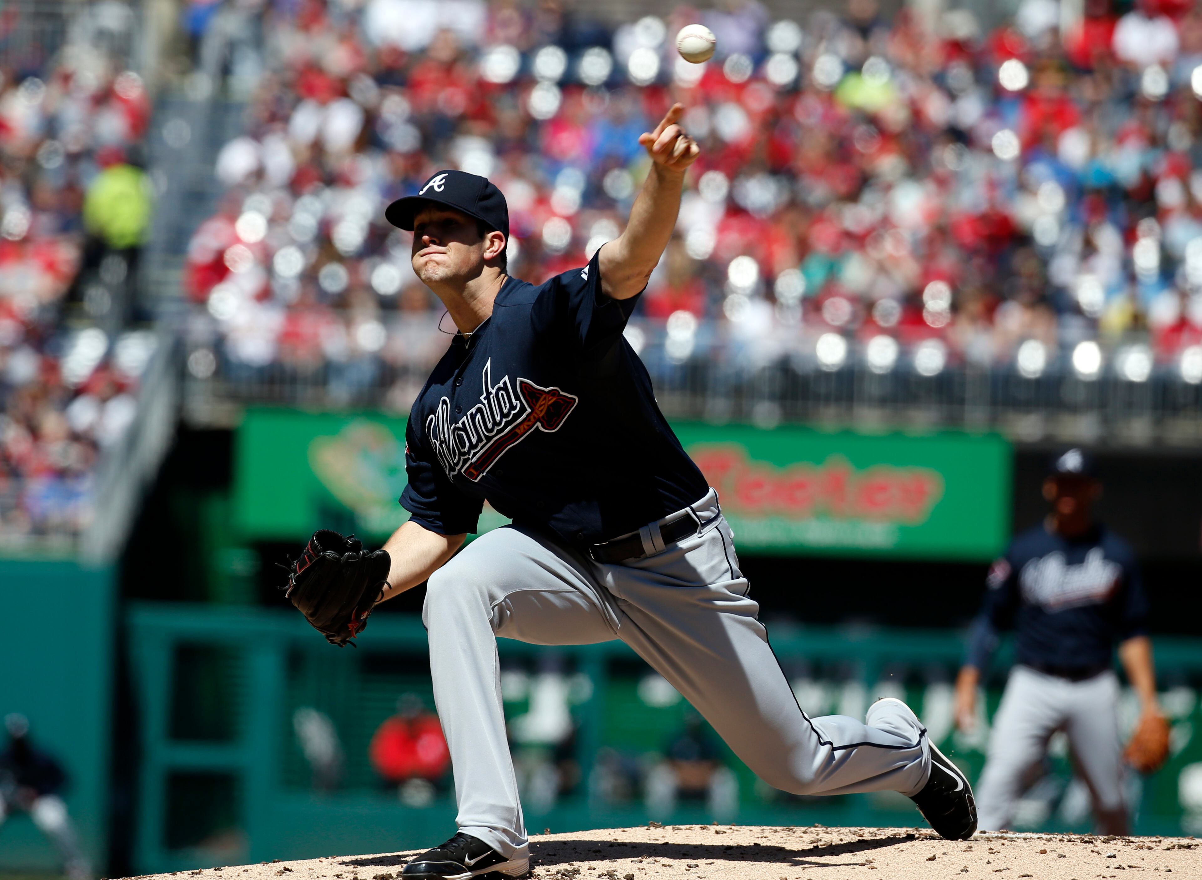 Atlanta Braves relief pitcher Alex Wood throws during the first inning of a baseball game against the Washington Nationals at Nationals Park, Sunday, April 6, 2014, in Washington. (AP Photo/Alex Brandon)