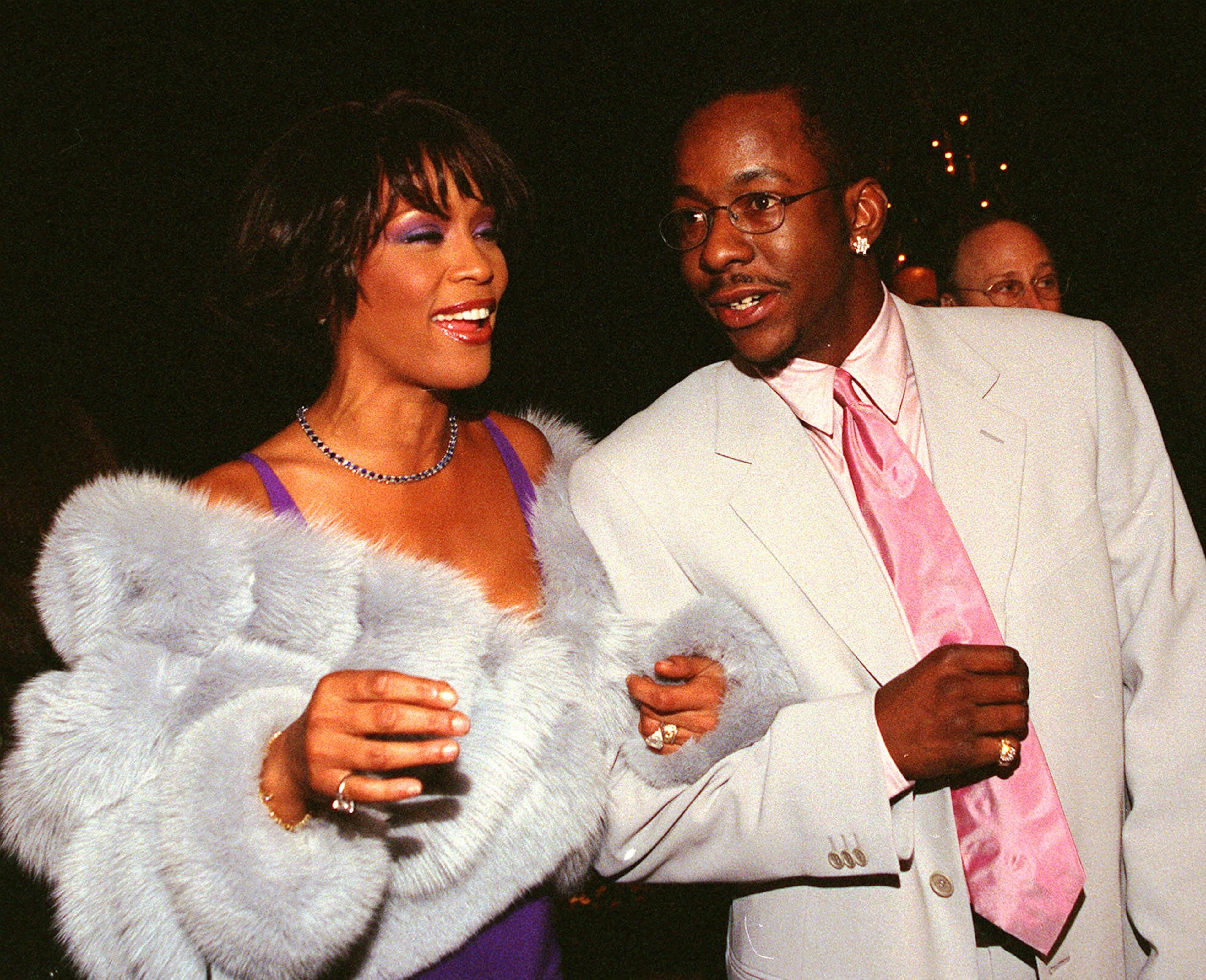 Singer Whitney Houston on the arm of her husband Bobby Brown arrive at the Atista Records pre-Grammy party Tuesday evening in beverly Hills, Calif. Houston is up for several awards at this years 42nd Annual Grammy Awards Wednesday at the Staples Center in Los Angeles.(AP Photo/Jill Connelly)