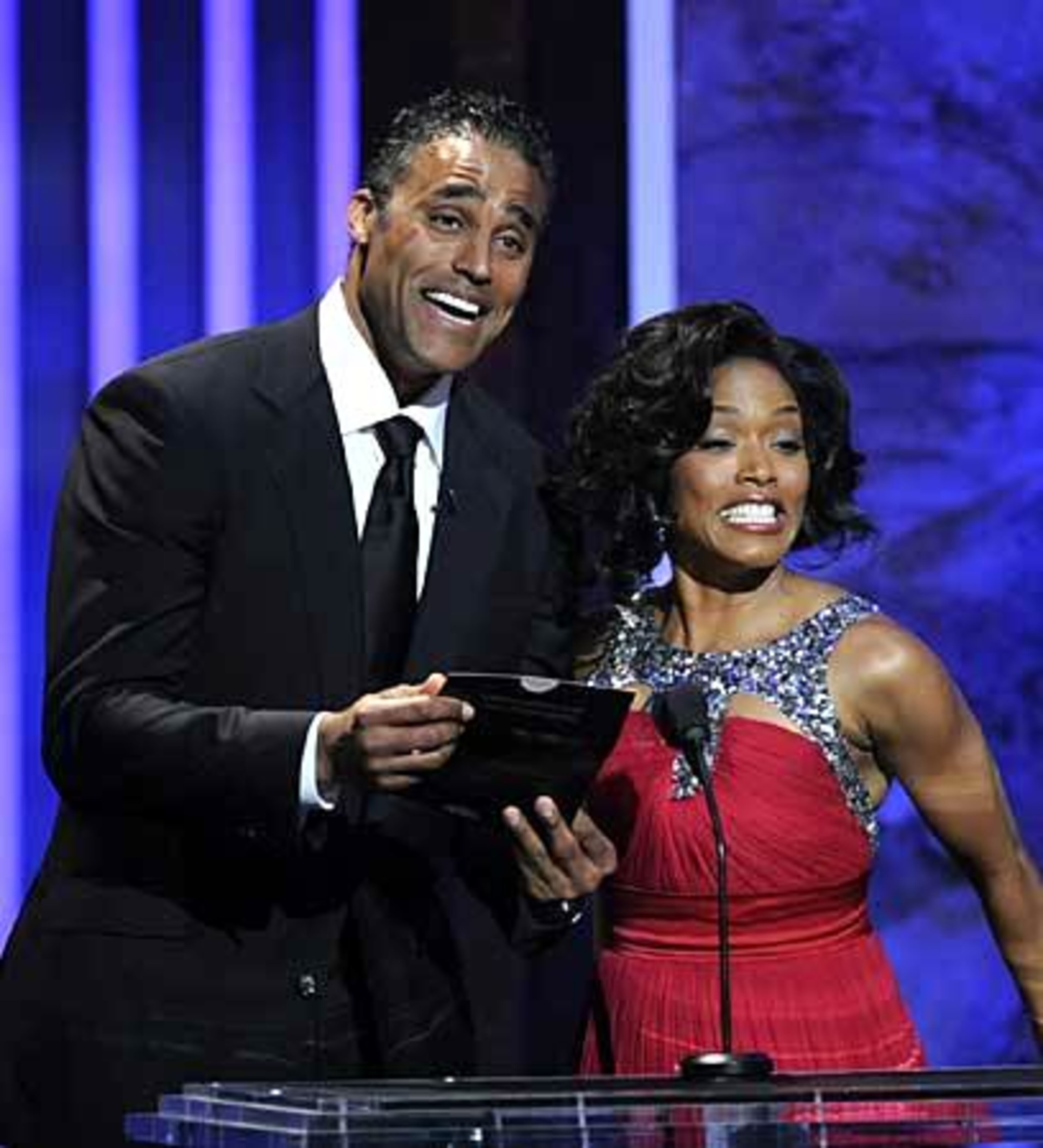 Rick Fox and Angela Bassett present an award at the 39th NAACP Image Awards.