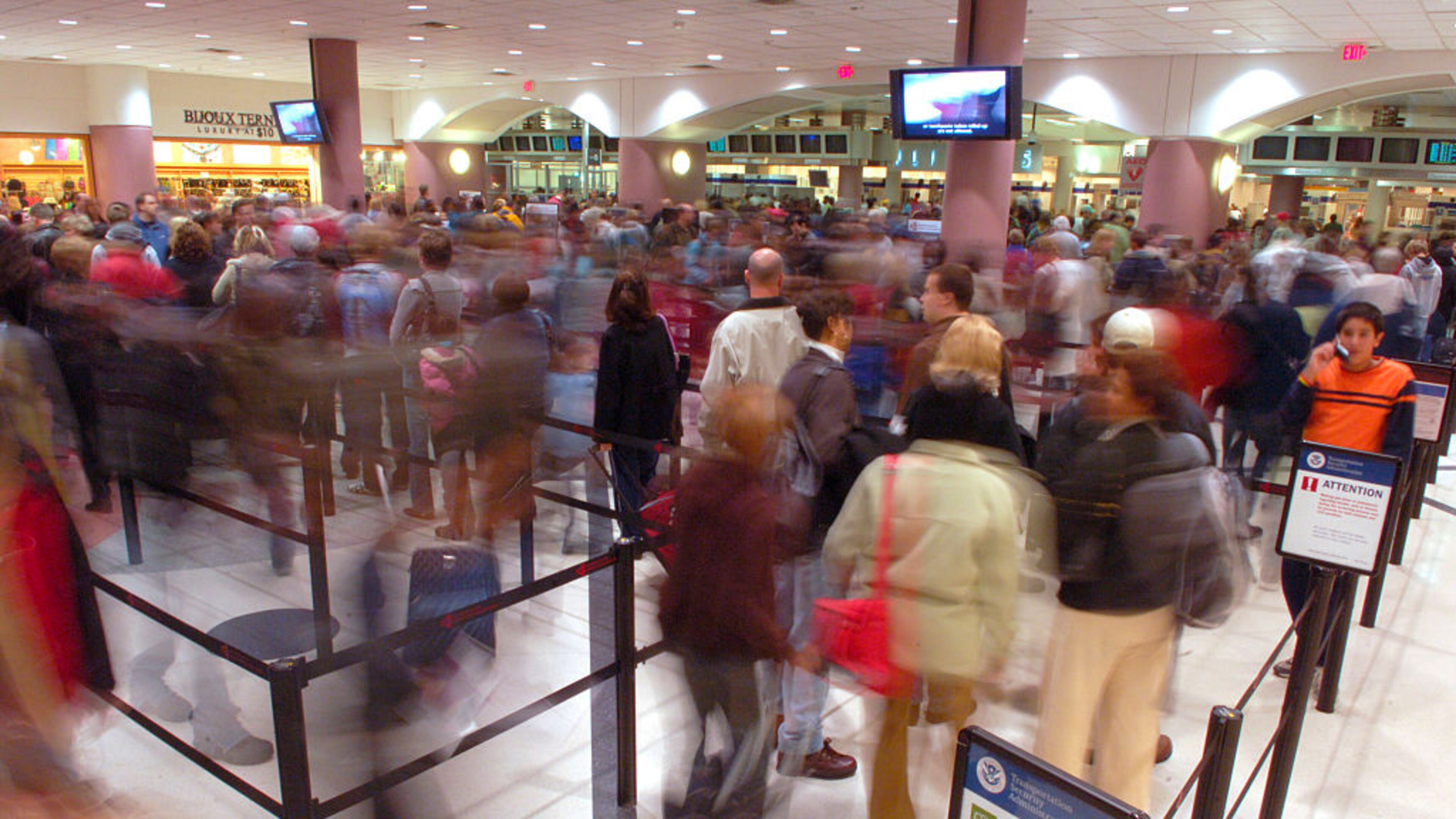 Passengers file through the security checkpoint at Hartsfield-Jackson International Airport in Atlanta, the day before Thanksgiving, the busiest travel day of year. (Photo by Chris Rank/Corbis via Getty Images)