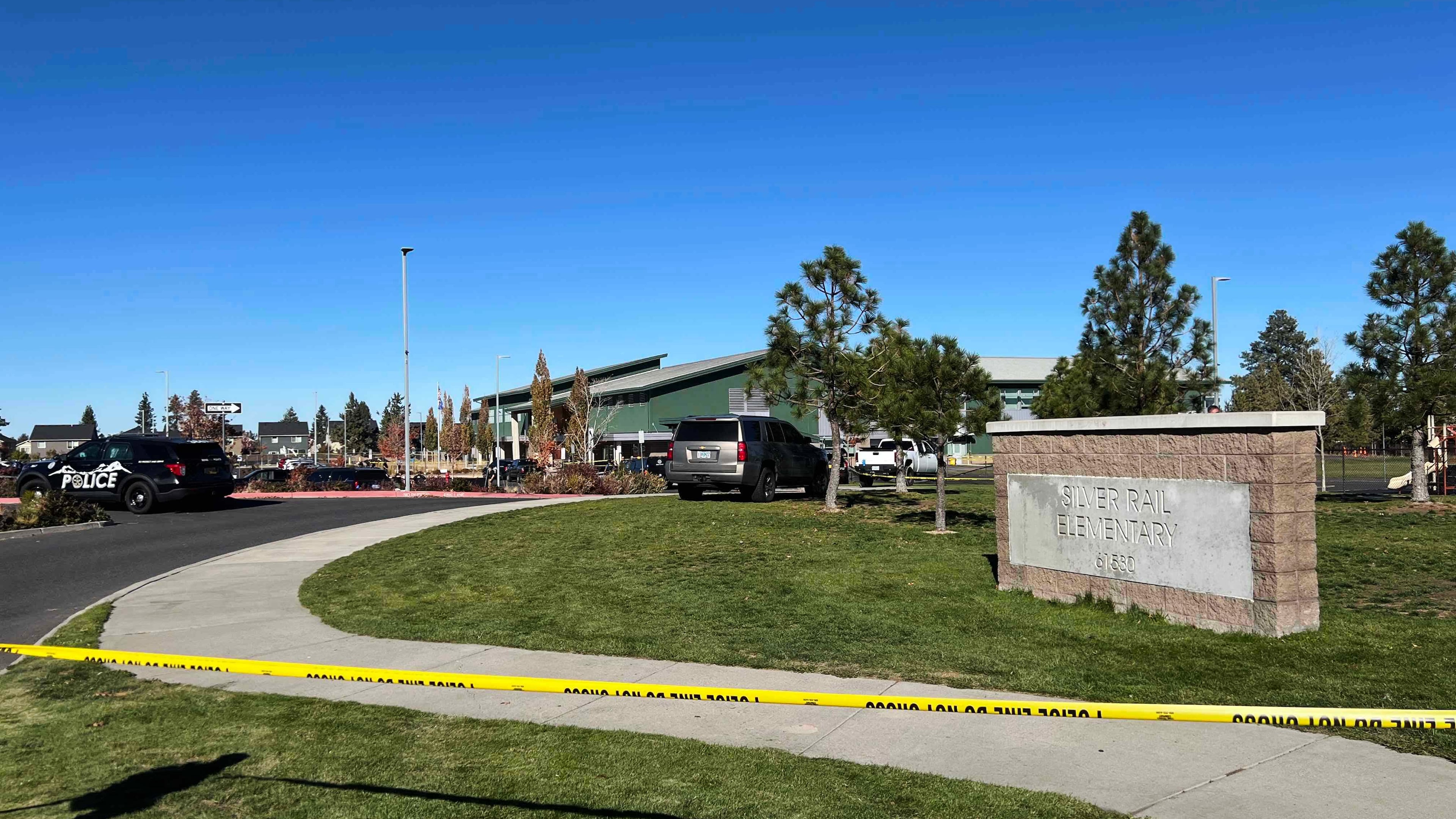 Police tape is placed outside Silver Rail Elementary school, where a shooting took place, on Thursday, Oct. 15, 2026 in Bend, Ore. (AP Photo/Joe Kline)
