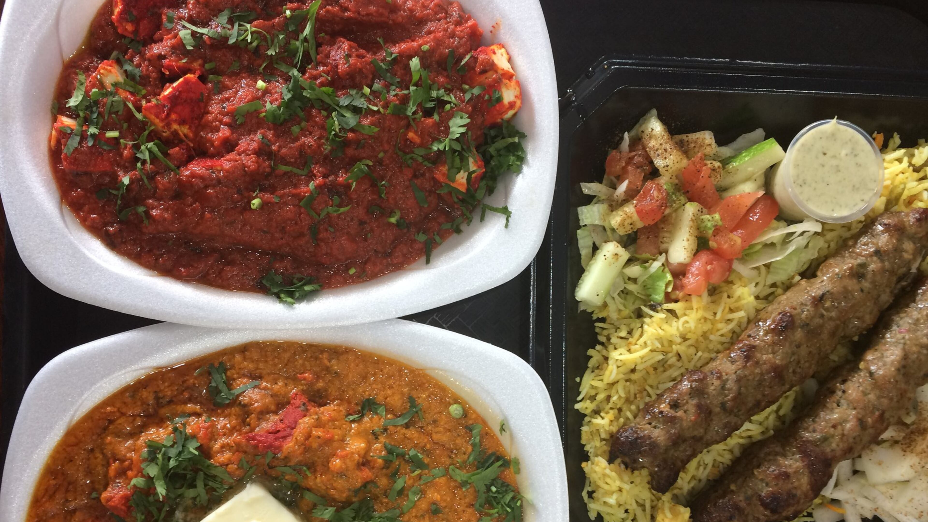 Kabab Express excels at “Indo-Pak” seekh kebabs like lamb (right), as well as other South Asian classics like paneer tava (cheese in spicy red chili sauce, upper left) and Butter Chicken Gravy (lower left). CONTRIBUTED BY WENDELL BROCK