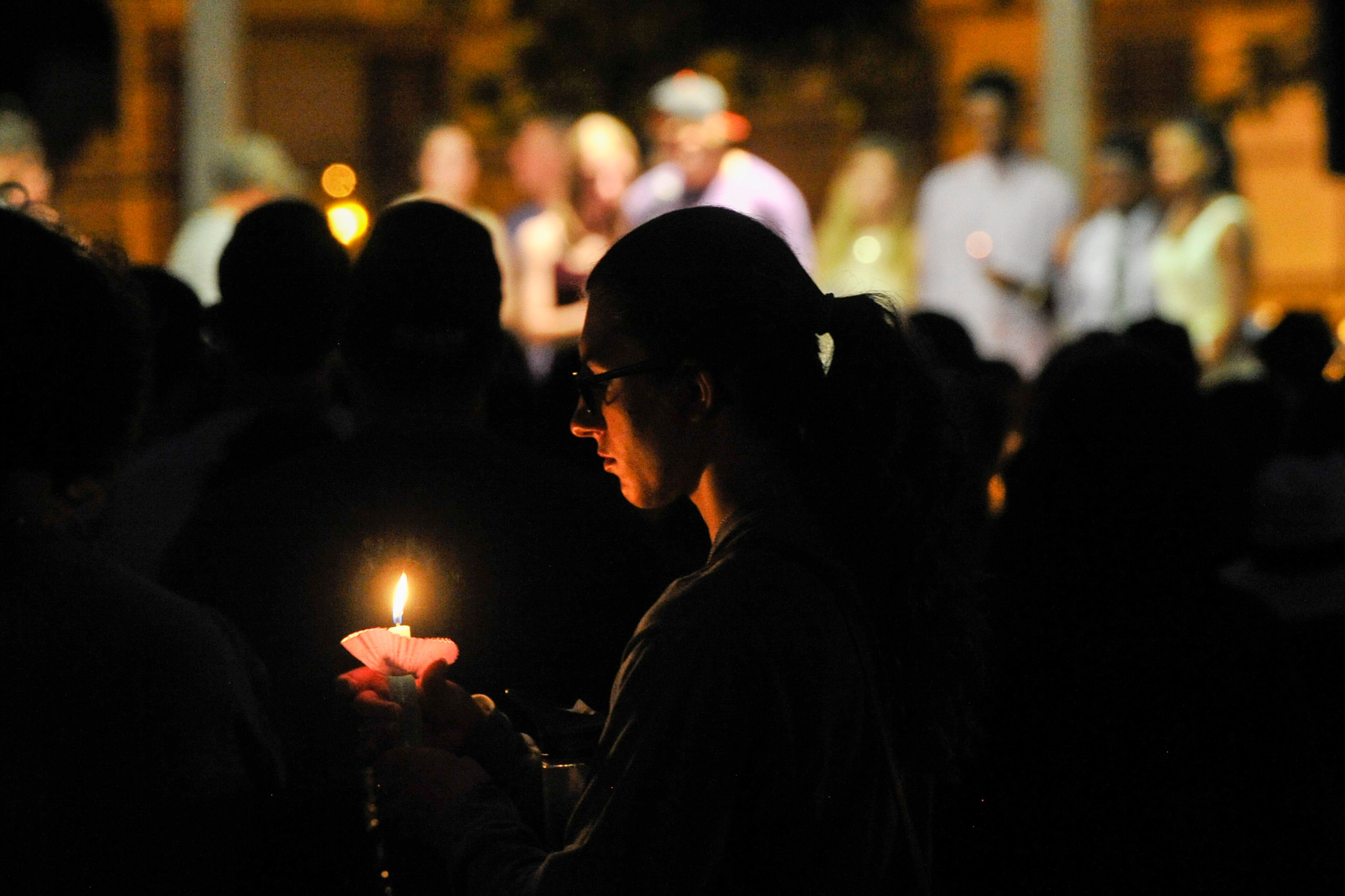 Friends of Natalie Henderson attend a vigil held for her on the old Roswell Square, Thursday, Aug. 4, 2016. Henderson, of Roswell, and Carter Davis of Woodstock, both 17, were found Monday behind a Publix grocery store shot to death. Jeffrey A. Hazelwood, 20, was arrested Wednesday and will be charged with two counts of murder in the deaths. (Photo Contributed by John Amis)