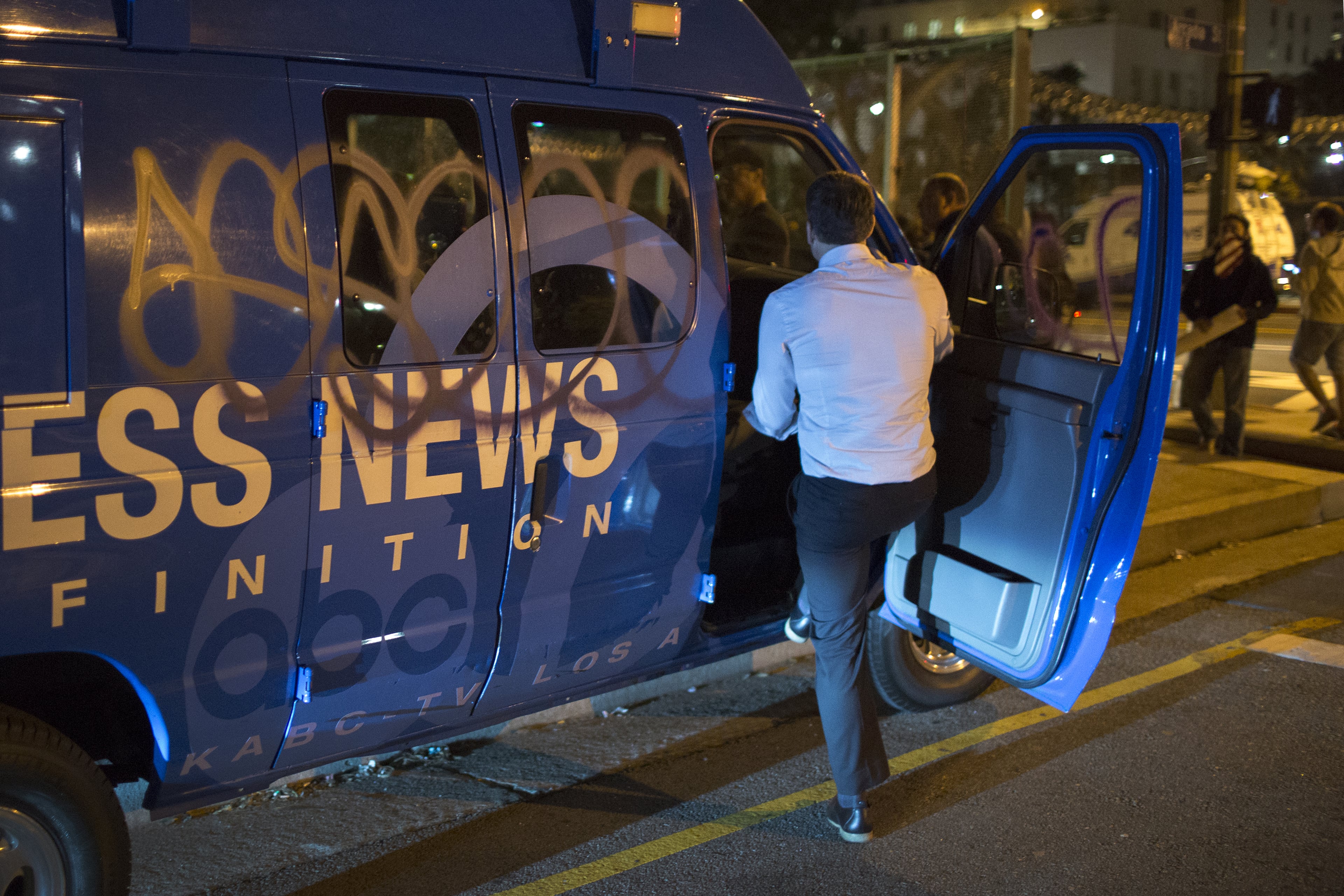 LOS ANGELES, CA - NOVEMBER 08: A television news van is vandalized with graffiti as protesters shut down the 101 freeway in opposition to the upset election of Republican Donald Trump over Democrat Hillary Clinton in the race for President of the United States on November 9 2016 in Los Angeles, California, United States. (Photo by David McNew/Getty Images)
