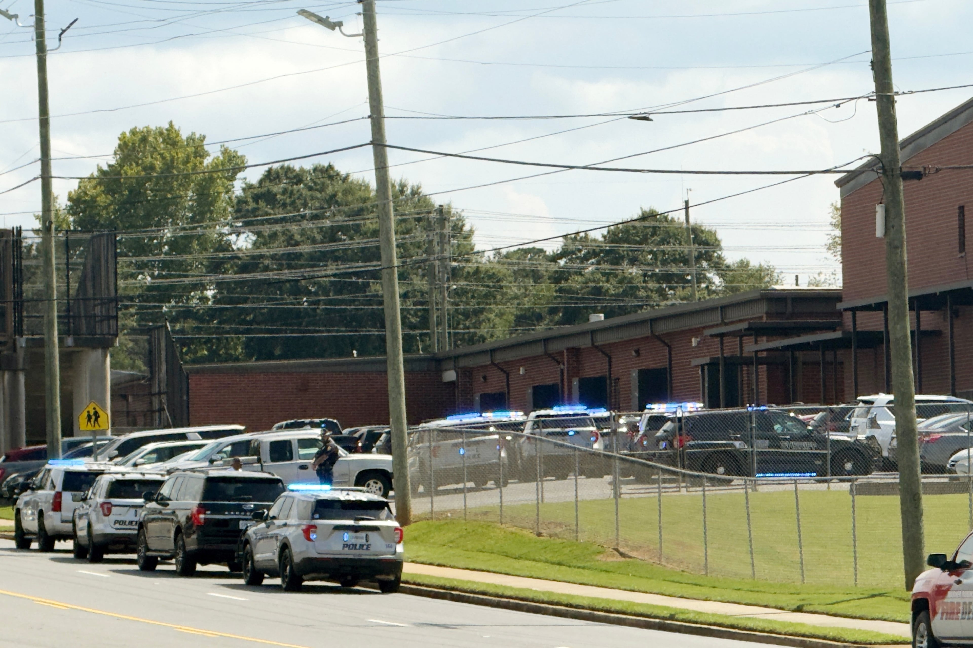 Law enforcement responds to a school shooting at Warner Robins High School, Wednesday, Aug. 12, 2026, in Warner Robins, Ga. (Joe Kovac/AJC)